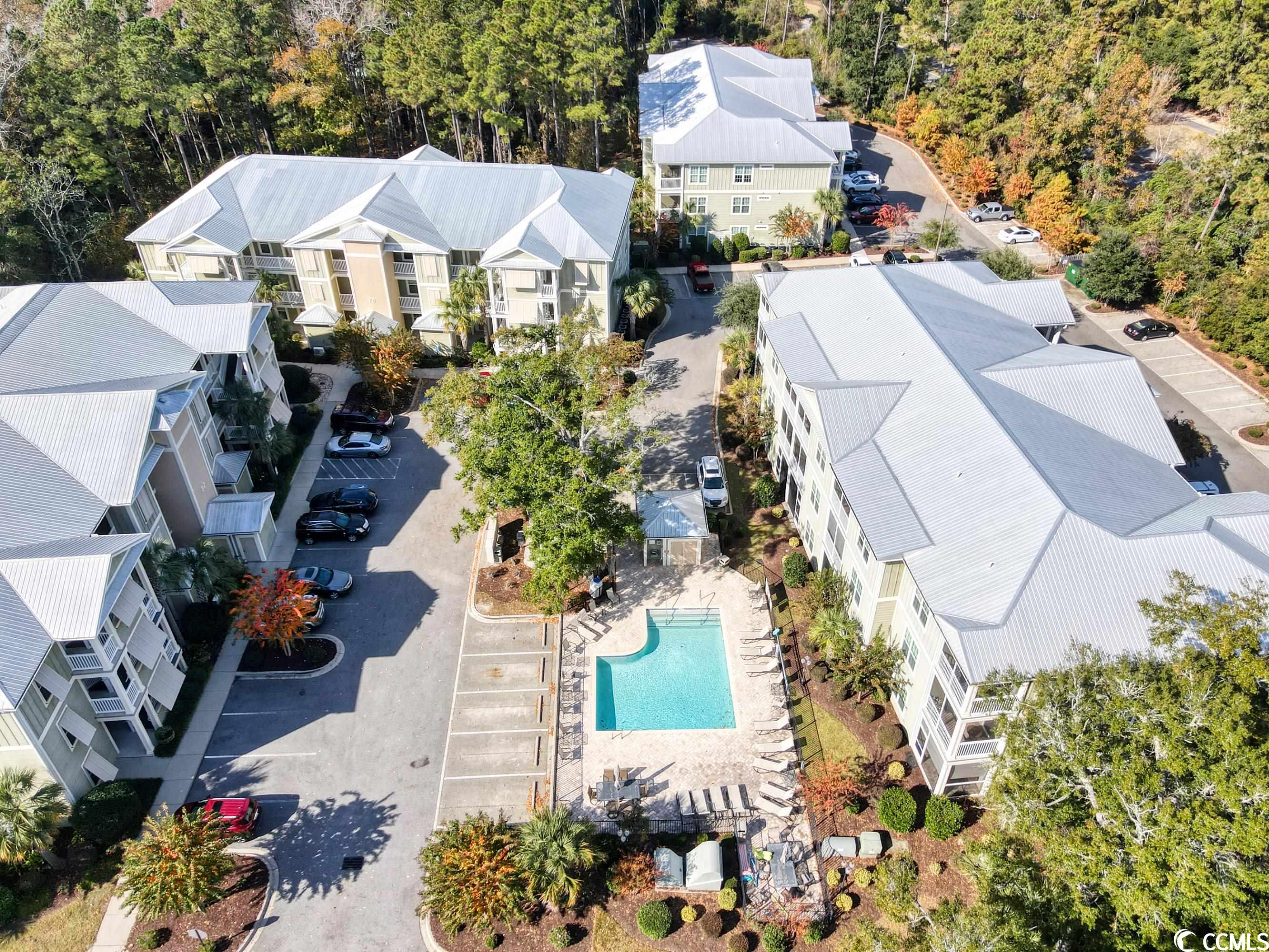 the very popular village at mingo. hasn't been a unit on market since august 2023. come check it out. beautiful 2br 2ba condo located in the westernmost building with private peaceful wooded views from great room and master bedroom. 2nd floor. steps and elevator access. community swimming pool, centrally located, a 5 minute drive to the beach and the waccamaw river. steps to quigleys and kudzoo bakery. and a short drive to all the golf, shopping and fine restaurants the area has to offer.