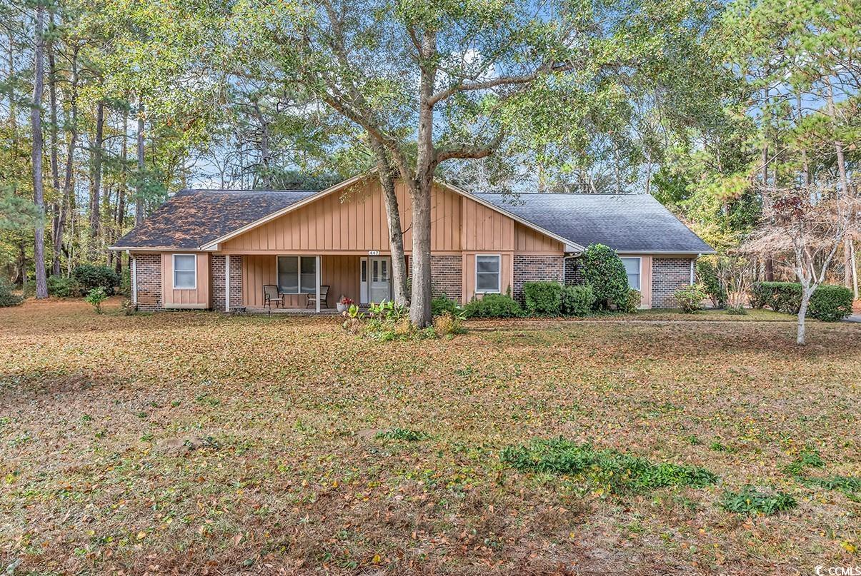 here is your chance to be in the desirable pawleys island neighborhood of hagley estates! this single level, brick exterior 3 bedroom, 2 bathroom home has an abundance of space, inside and out. a sizable kitchen with new granite countertops (2020) and lvp flooring (dec 2023), formal dining room, living room, carolina room and screened porch with extensive views of your secluded backyard. loads of cabinets and storage space in the kitchen and the oversized 3 car garage. (880 square feet of garage space!) the 3rd bay is temperature controlled--use it as a workshop, hobby area, golf cart parking and more. this well-built and maintained custom designed home sits on a unique .79 acre lot (originally 2 lots merged together) offers plenty of privacy with its picturesque trees and mature landscaping with the founders club golf course and a pond as your neighbors behind. this a must see home in scenic pawleys island! (all figures are approximate and not guaranteed. buyer responsible for verification.)