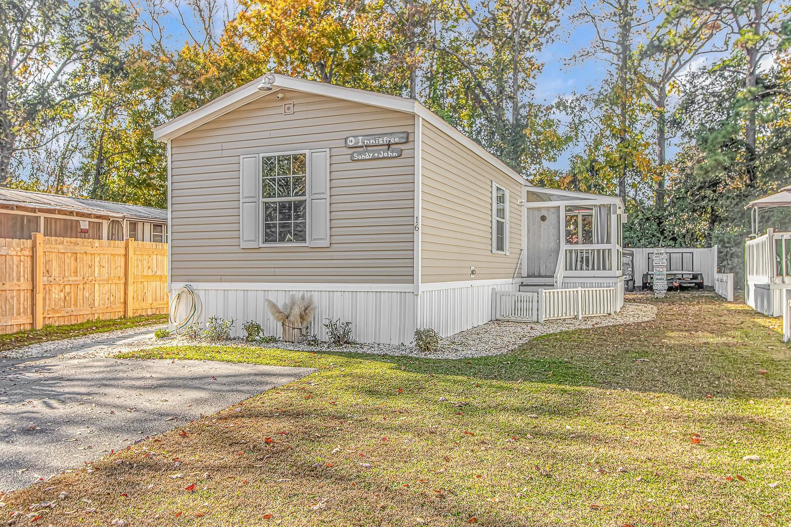 cozy and beachy 2/2 home located in the heart of garden city beach with quick and easy access to the beach, shopping, restaurants, fishing, golf and more.  close to the beach without the the cost. this well kept 2015 destiny home has sheetrock walls, split bedroom floorplan, screen porch, brand new privacy fence, large 6x12 storage/workshop with a 8x10 overhang for your golf cart and sitting on a private lot with plenty of room.  windjammer village is a beautiful & quiet coastal community that offers low rent, a pool, clubhouse, trash removal, golf carts are allowed, pet friendly and excellent management. no hoa. this home comes completely furnished so it's ready for move in. carefree living and minimal maintenance. perfect for a primary or secondary home, no rentals are allowed in windjammer village. all measurements and information are deemed liable and are not guaranteed.  buyer is responsible for verification.