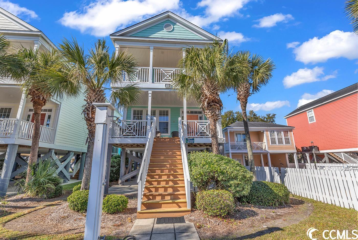 discover the surfside beach lifestyle in this charming raised beach house, a perfect investment property with coastal flair. ideally situated across the street from the new surfside beach pier, this top-tier location offers proximity to dining and nightlife, all within easy walking distance. step inside to find a home loaded with features, including hardie board siding and an ocean-view deck on the main level. a rare community pool adjacent to the property adds to its appeal. the interior boasts an open-floor plan, seamlessly blending the kitchen, dining, and living areas. the kitchen is well-appointed with white cabinets, a spacious breakfast bar seating five, and a separate dining room table with tile flooring throughout for easy cleanup after sandy beach days. this fully furnished property is turnkey, ready for your enjoyment. convenience is key with one bedroom and a full bathroom located on the main level. the master suite is a retreat with a walk-in closet, double sink vanity, and an oversized garden tub/shower. enjoy the charm of the master suite, featuring sliding glass doors leading to a private balcony with ocean views.  additionally two more bedrooms with two beds each are located down the hall with each having their own private full bathroom.  parking is ample underneath the home, complemented by a small storage room for securing beach supplies. the front of the house is fenced with a new gate, providing privacy and safety for little ones and pets. all measurements and square footage are approximate and not guaranteed; buyers should verify.