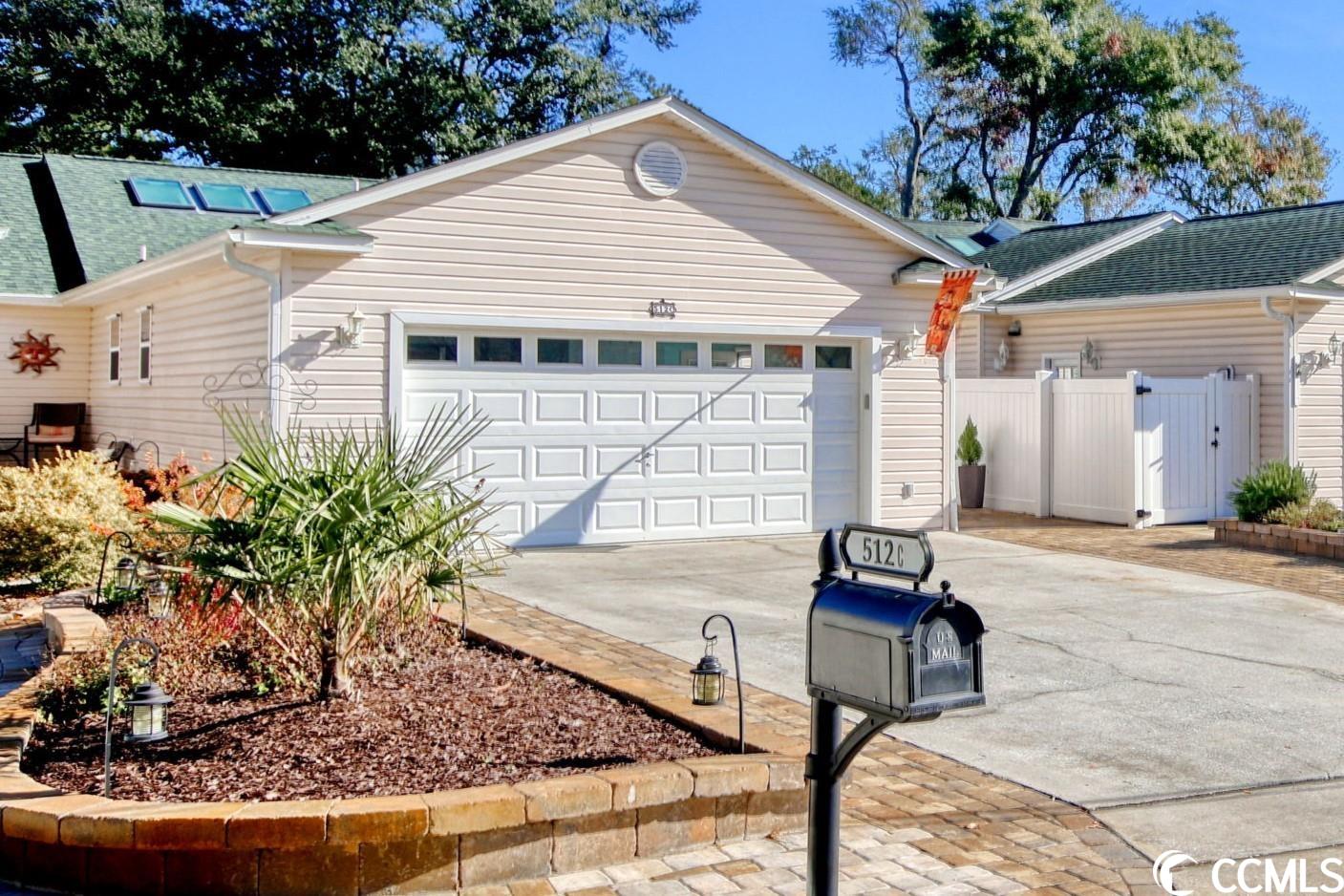 in the heart of surfside beach! east of 17 business! 512c 4th ave s - a fantastic single level townhome with 3 bedrooms, 2 full baths, carolina room and a large 2 car was built with easy beach living in mind & tastefully updated for a lifetime of enjoyment. a fantastic open concept anchored by an impressive, vaulted ceiling! the kitchen was recently renovated with marble countertops, stainless steel appliances, tile backsplash, new sink & faucet, new cabinet hardware & inserts. living room, carolina room, kitchen, bathrooms and one bedroom recently updated with lvp flooring; two bedrooms updated with high quality carpet. new shower and vanity in the master bath & two closets in the master bedroom. full size laundry room. hvac 2021. enjoy a low maintenance exterior with top-quality installations - front yard pavers, gardens, landscaping, front porch decking, private outdoor shower with hot/cold water and private walkway with 6’ fencing were completed recently. a backyard oasis with more updates - a large paver patio, 6’ privacy fencing, lush gardens, a gazebo & two gas connections for a fire pit & grill. garage updated with newage cabinets, new entry steps and epoxy floor coating. pull-down stairs lead to floored attic space. other updates include plantation shutters, remote controlled skylight blinds, barn doors, storm doors, lighting and fans. a comfortable size whether staying for the weekend or staying all year! 512c 4th ave s is superbly located in the heart of surfside beach!