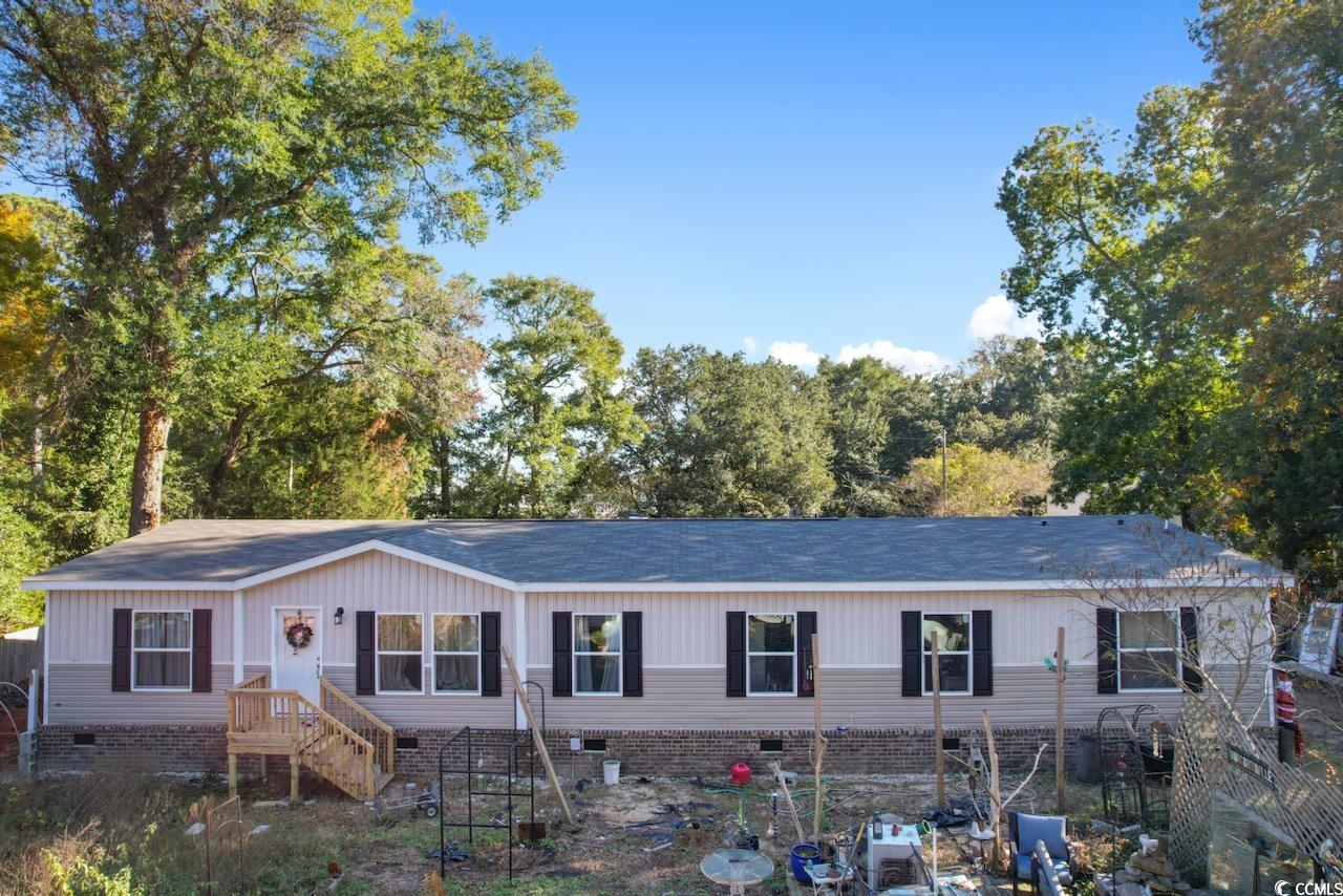 location! location! location! welcome to 3816 colony ct, a pristine 5-bedroom, 3-bathroom manufactured home that feels almost brand new. nestled on a permanent brick foundation, this residence is situated on a generously sized lot in the highly desirable locale of murrells inlet, sc.  this lot and home can also be sold with neighboring lot and home which connects to myrtle drive and totals 1/2 acre.  this charming home boasts modern features and an open-concept layout, providing both comfort and functionality. the kitchen is a chef's delight, equipped with contemporary appliances and ample counter space, making it perfect for culinary enthusiasts and entertaining guests.  enjoy the best of coastal living with the property's strategic location close to the marsh and the ocean. take leisurely strolls to enjoy the serene marsh views or head to the nearby sandy shores for a day of sun and surf. the allure of murrells inlet's natural beauty is at your doorstep.  one of the standout features of this property is its lack of homeowners association (hoa), offering you the freedom to personalize and utilize your space as you see fit without the constraints of association rules. embrace the opportunity to create your own oasis without limitations.  additionally, the home's proximity to various amenities, dining options, and entertainment ensures that you'll have everything you need within reach. experience the convenience of a great location paired with the tranquility of coastal living.  don't miss the chance to make this house your home. embrace the coastal lifestyle, relish the spaciousness of your lot, and create lasting memories in this almost-new manufactured home on a permanent brick foundation. your dream home awaits at 3816 colony ct, murrells inlet, sc 29576.
