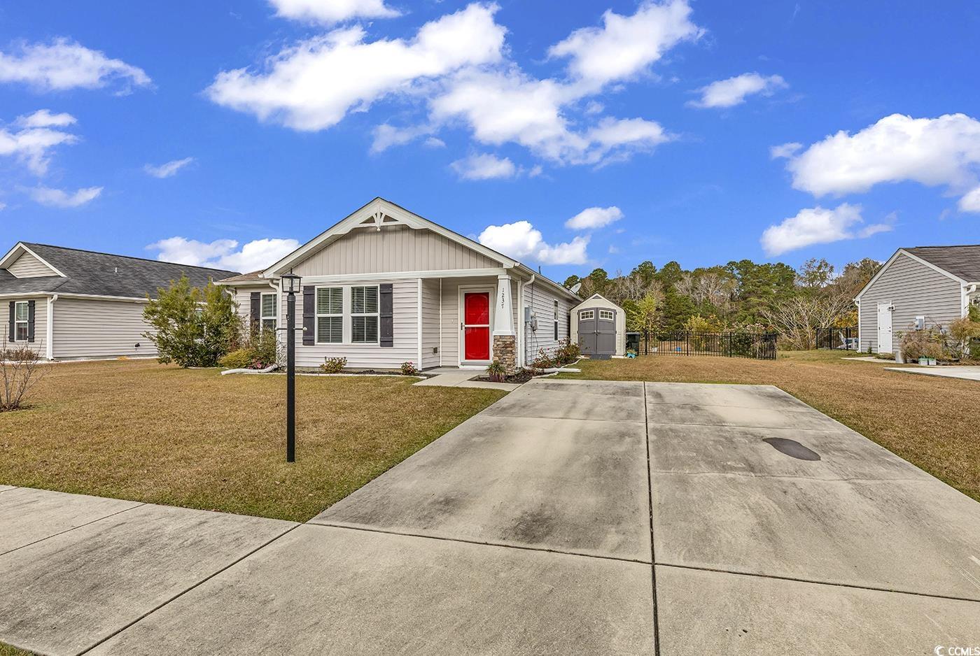 this immaculate three-bedroom, two-bathroom home with a fenced-in backyard and a lovely living room view of a pond! here's why it makes perfect sense to purchase this home. first off, it costs less than a newly constructed home. second, a wrought iron fenced yard and a storage shed.  second, it comes with a refrigerator, washer and dryer, curtain rods, luxury curve shower rods, and more.  as you know, all these would cost you thousands of dollars extra, but not here.  there's also a view of a pond, which in general, would cost more than a regular parcel. here you don't have to worry about that.  downtown conway's shops and grocery store, coastal carolina university, horry-georgetown tech, and the ocean are all within a short drive!  this home is a no brainer!