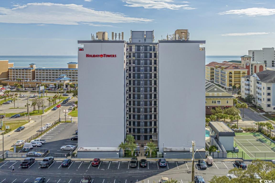 welcome to this fully furnished & move-in/rental-ready 2 bedroom, 2 bathroom condo at the holiday towers in the heart of myrtle beach. the kitchen is equipped with all updated stainless steel appliances, upgraded granite countertops, a large stainless sink, and an open window that looks into the main living and dining areas, giving a more open concept. the living room features a large sliding glass door, leading to your 1st floor patio with easy courtyard access. each bedroom includes a tv, plenty of closet space and access to its own bathroom with upgraded vanities and fixtures. there is a laundry room in the unit with a washer and dryer included, for even more added convenience, along with new lvp flooring throughout, and a digital thermostat. holiday tower has been recently painted & refreshed, and offers great amenities including an outdoor pool, hot tub, basketball and tennis courts, grills, fitness center, gated-private parking, and more! perfectly situated near all of the grand strand's finest dining, shopping, and entertainment attractions, and on the second row from the ocean with just a few steps from your door to the beach. whether you are looking for an investment opportunity or a vacation get away, you won't want to miss this- schedule your showing today!