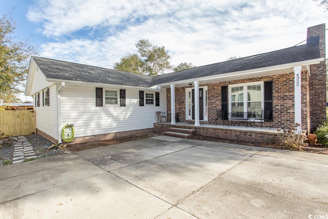 have a look at this beautifully remodeled home in a quaint neighborhood with no hoa in little river, sc!  it still has some of it's original bones to showcase its unique appeal.  huge living area features a fireplace perfect for lounging.  living room leads into the large dining area and the kitchen with additional bar seating. the kkitchen was remodeled with stainless steel appliances, a gas range, and beautiful quartz countertops.  all windows have been replaced.  trane heat pump was installed in 2016 which is a high efficiency 18 seer system with communicating variable speed.  all duct work was redone in 2016 when the new heating/cooling system was installed. current owners encapsulated the crawl space and had a dehumidifer installed in 2021.  fenced-in back yard for added privacy, a nice storage building, and a bar built out back for enjoying our temperate year-round weather here in the coastal carolinas!  perfect location to all that this wonderful area has to offer.  you're surrounded by world class golf courses, great restaurants, and only a 5-10 minute drive to the sand on cherry grove beach.  north myrtle beach is only a few minutes away for even more shopping, restaurants, and golf courses.  this one is a home run for those looking to enjoy the great location, modern updates with the older home character still entact, and no hoa fees or hassles to worry about!