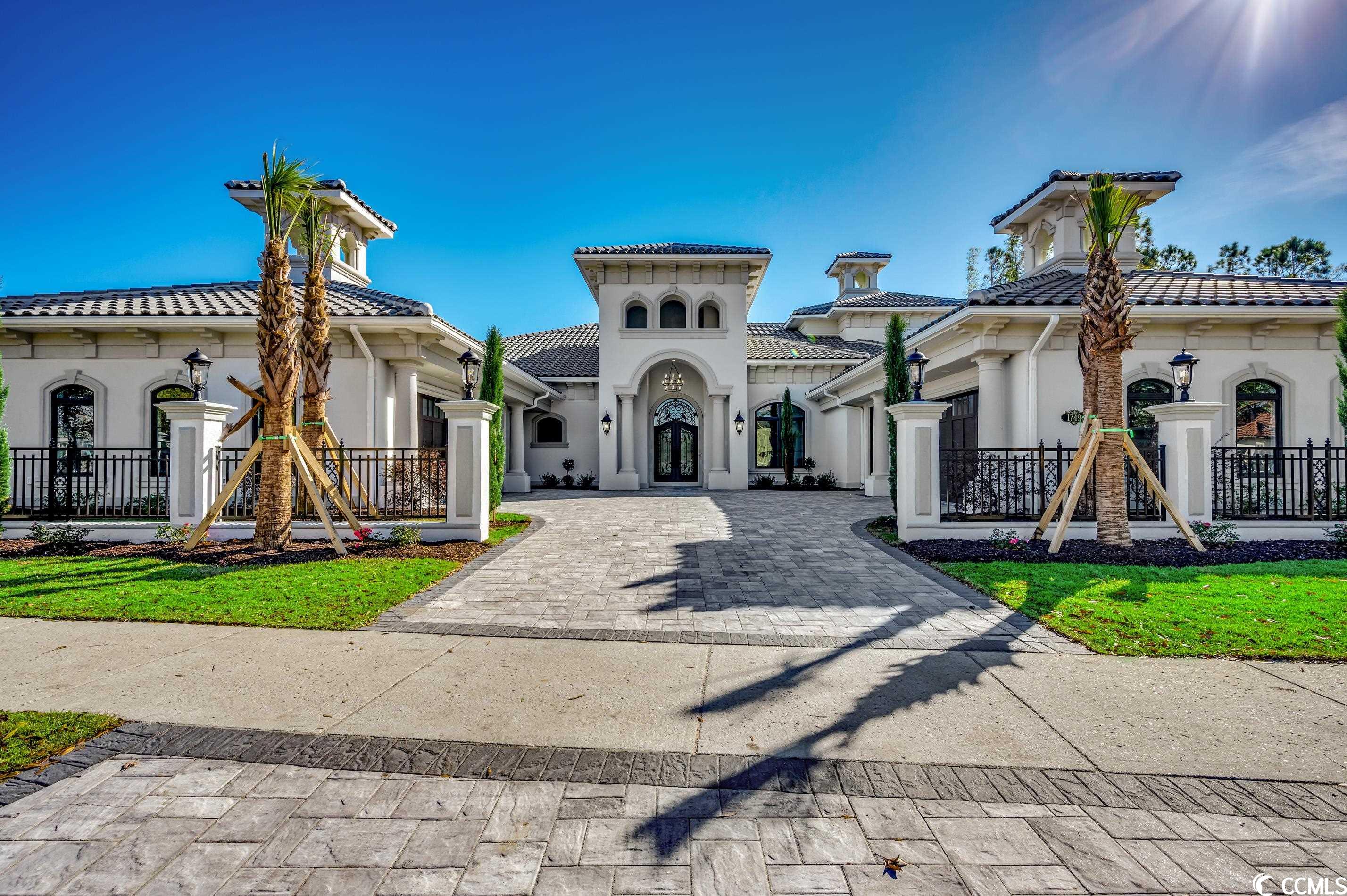 don't miss out on this wonderful opportunity to customize this brand new 5 bed 5.5 bath mediterranean masterpiece located inside the gated community of bal harbor at grande dunes. this home is being built on one of the last waterway lots available and boasts .75 acres. this home will feature 5 bedrooms with 5.5 baths on the main floor and 1 bedroom with a full bath and game room on the second that over looks the icw. also included will be a 4 car garage, boat dock with lift, outdoor pool and spa with breathtaking waterway views. some of the photos are of a similar house that was just built in a different section of the community. this house will differ slightly. grande dunes is a 2200 acre amenity-rich development filled with lifestyle opportunities unrivaled in the market. owners also enjoy the exquisite ocean club that has fine dining, ocean front pools, meeting rooms, beach amenities and is truly are remarkable place for events. grande dunes include two prestigious 18 hole golf courses. the resort course is open to the public and the nick price designed "members club" is semi private. other features are a 126 wet slip deep water marina able to accommodate vessels up to 120 feet or more and a state-of-the art har-tru tennis facility. grande dunes is a wonderful and private community that sits conveniently in myrtle beach, close to shopping, dining and roughly a mile from grand strand medical center. come live the grande dunes lifestyle! contact the listing agent for more information and to schedule a viewing.