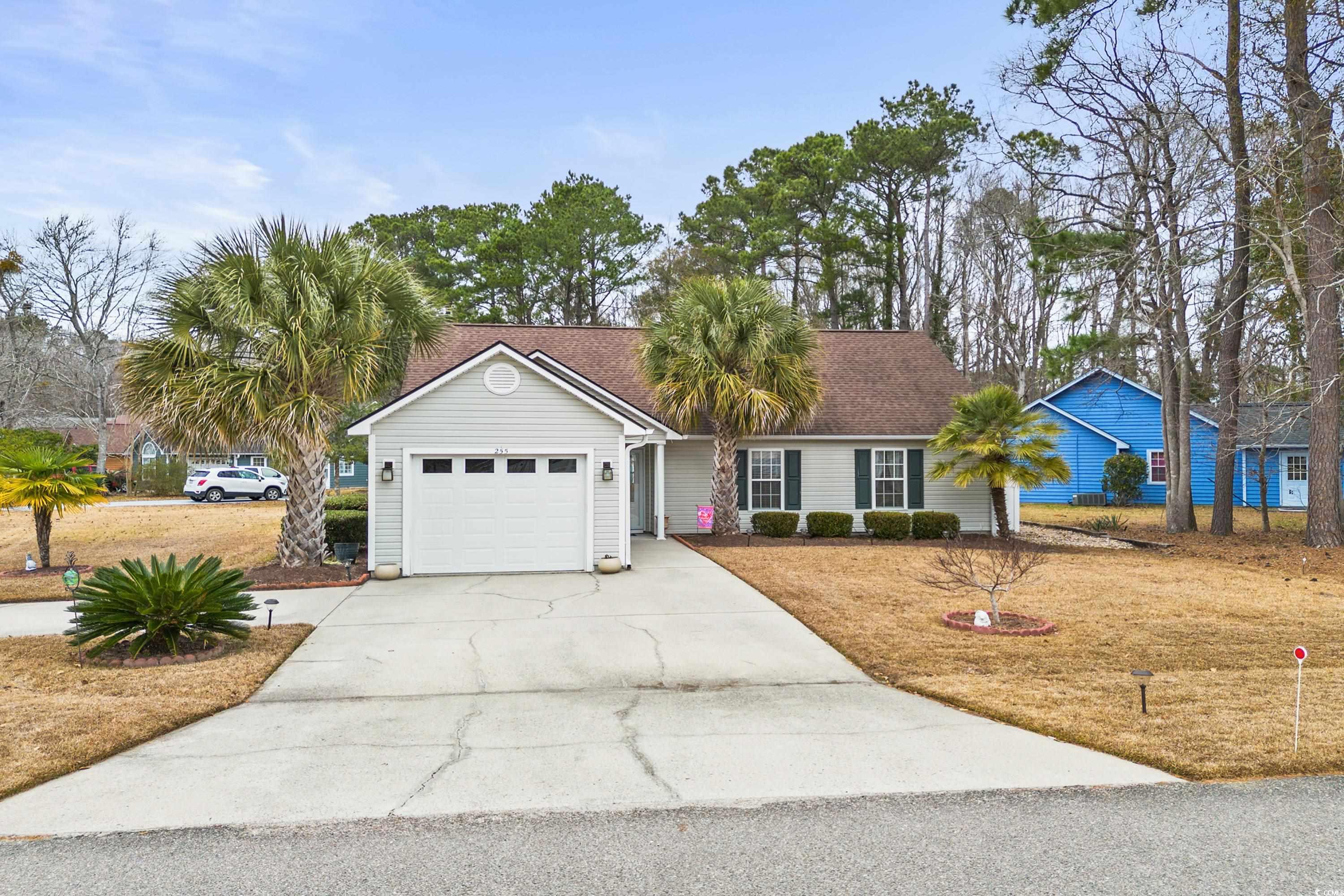 rare find!  don't miss this great location less then about 10 mins to the sought out cherry grove beach. cozy 3 bedroom, 2 bath with a carolina room on an large corner lot with a circular driveway. living room and dining room have cathedral ceilings with built ins. roof and hvac replaced about 6 years ago.  this house has been freshly painted, updated oven, light fixtures/fans, new hot water heater, front and back door. carolina room and patio overlook large partially fenced yard.  on a hot summer day just walk right across the street to the community pool.  this community is conveniently located to route 31, shopping, restaurants, beach, golf and so much more but you are just outside the hustle and bustle for a quiet setting.