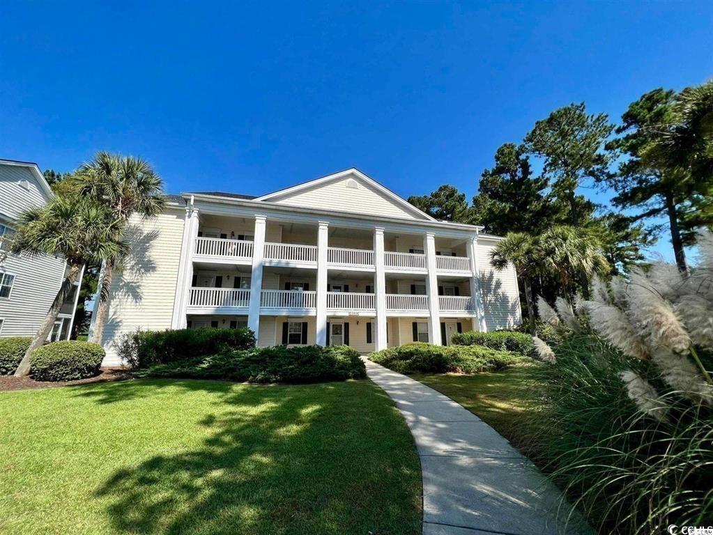 situated in the highly desirable windsor green community, located in the heart of the popular carolina forest area of renowned myrtle beach, this 2 bedroom, 2 bath end unit offers gorgeous views of the 15th green of the wizard golf course and glistening pond with direct access to the community pool! the flowing open floor plan includes a large, screened porch with access from both the main living space and the primary bedroom ~ providing the perfect place to relax and enjoy the surrounding views with an early morning cup of coffee or with a favorite beverage later in the day. after spending a fun-filled day at the beach, playing golf, shopping at the tanger outlets or experiencing the various entertainment options, returning home to your private oasis will be the perfect way to end any adventure! another plus for this end unit is all the natural sunlight that enters the home from additional side windows that flows through the open kitchen and into the separate dining area and adjacent main living area. the primary bedroom is large enough to comfortably add a king-size bed and offers direct access to the balcony with views of the golf course, two separate closets and an en suite full bath. the second bedroom and full bath more than adequately accommodate family and visiting guests. there is also a separate laundry room. recent renovations include lvp flooring throughout, new appliances, light fixtures and paint. the windsor green residents and their guests are able to enjoy use of the community clubhouse, 2 pools, playground and outdoor grilling area. additionally, short-term rentals are permitted.