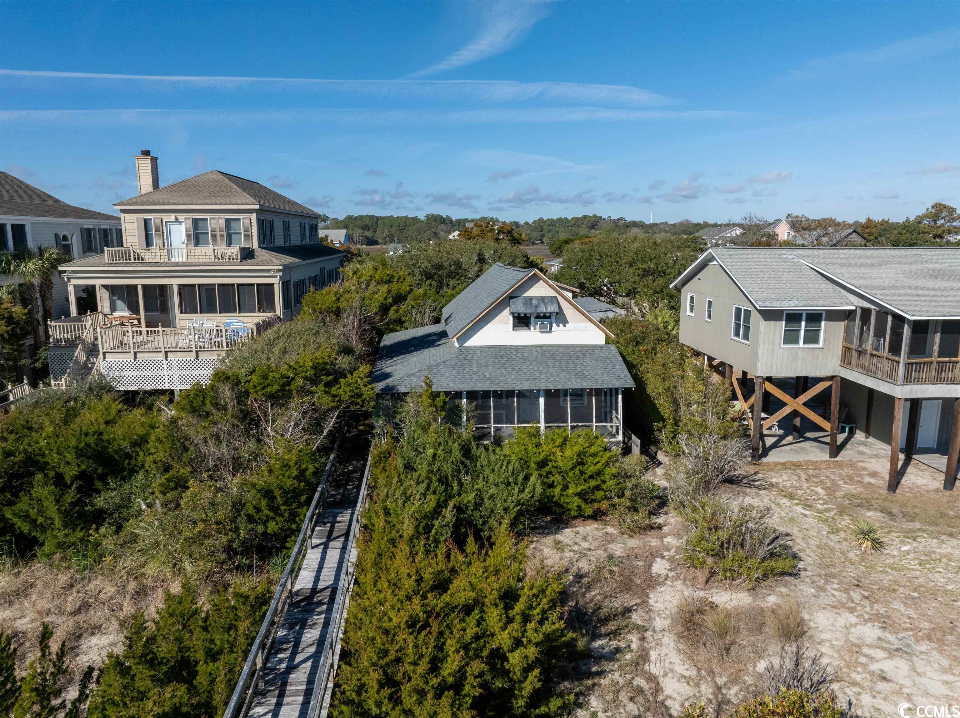 rare ocean front dream home opportunity! this beach house sits on the very desirable north end of pawleys island. you can build your dream home on this beautiful lot, with amazing views of the ocean. the sellers had building plans drawn up, which are in the associated documents. watch breathtaking sunsets from a porch or boardwalk overlooking the ocean.  this is a true gem in a prime location on pawleys island with things to do all year round such as kayaking, fishing, biking, and more! don't miss out on this fantastic property with endless opportunities!