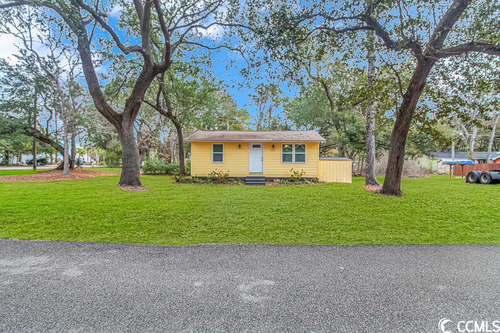 location, location, location!! this adorable tiny home sits on almost a quarter acre corner lot with no hoa in the heart of murrells inlet.  this home is within walking distance to the marsh walk and minutes to the atlantic ocean.  live the true inlet life!  home is being sold as-is. this gem will not last long! buyer is responsible for verifying square footage.