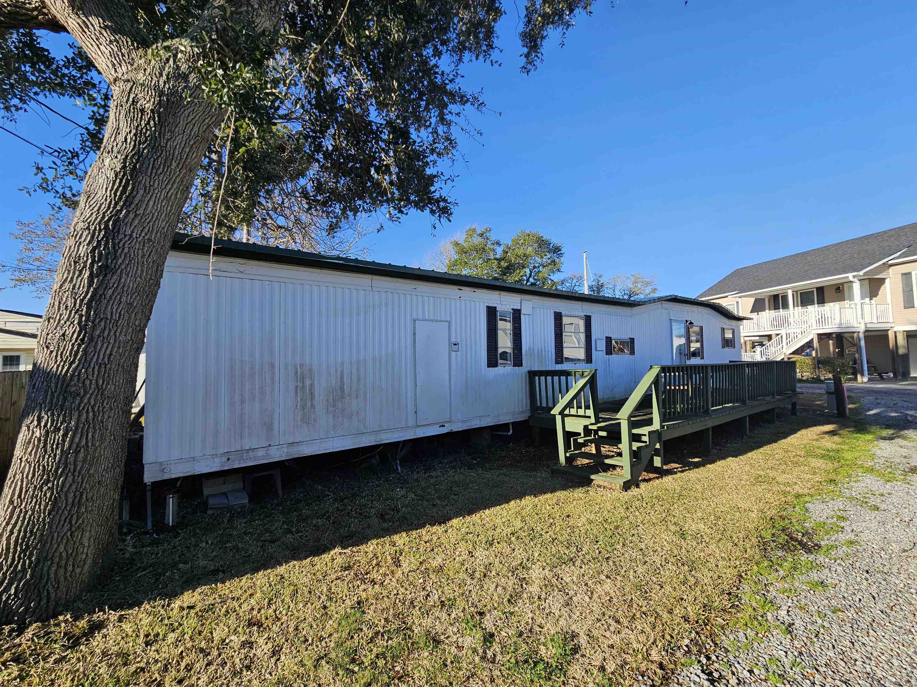 if you have been searching for an affordable cottage at the beach, look no more. this manufactured home located only 3 blocks from the beach is one in which you own the land. the home could use some tlc. no hoa.