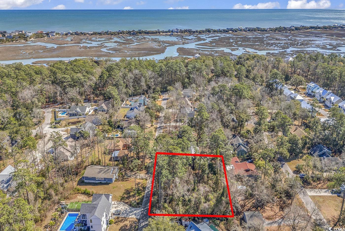 nestled within the charming coastal community of pawleys island, this rare offering presents an exceptional opportunity to own your own slice of lowcountry paradise. boasting approximately 0.34 acres of pristine, untouched land, this property provides a canvas for your dreams of coastal living to come to life. just a stone's throw away from the sandy shores of pawleys island, enjoy effortless access to sun, surf, and relaxation. spend your days strolling along pristine beaches or soaking up the warm carolina sunshine. despite its secluded feel, this property is conveniently located near a wealth of amenities, including shopping, dining, and entertainment options. explore the unique boutiques and eateries of pawleys island or venture further afield to nearby attractions. situated within close proximity to major highways and thoroughfares, this property offers easy access to neighboring towns and cities. whether you're heading to myrtle beach for a day of excitement or charleston for a taste of history, the possibilities are endless.