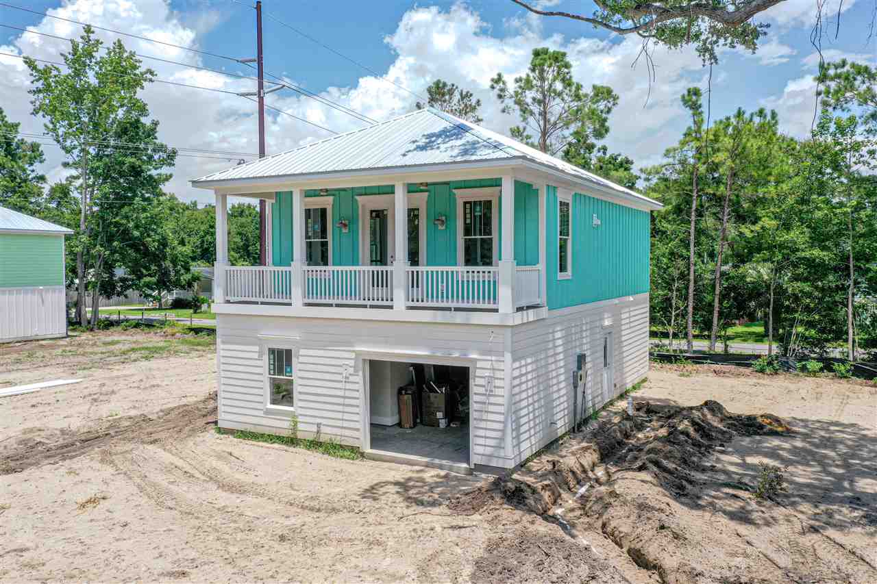 bungalow bay features 28 homes designed with modern coastal style and conveniences. this planned subdivision built by premier coastal builder offers a coastal contemporary beach home with an open floor plan that has 3 bedrooms, 2 baths with garage for car and golf cart. kitchen has granite counter tops, shaker style cabinets and stainless appliances. this subdivision is conveniently located in the heart of garden city with short drive to the beach and murrell's inlet.