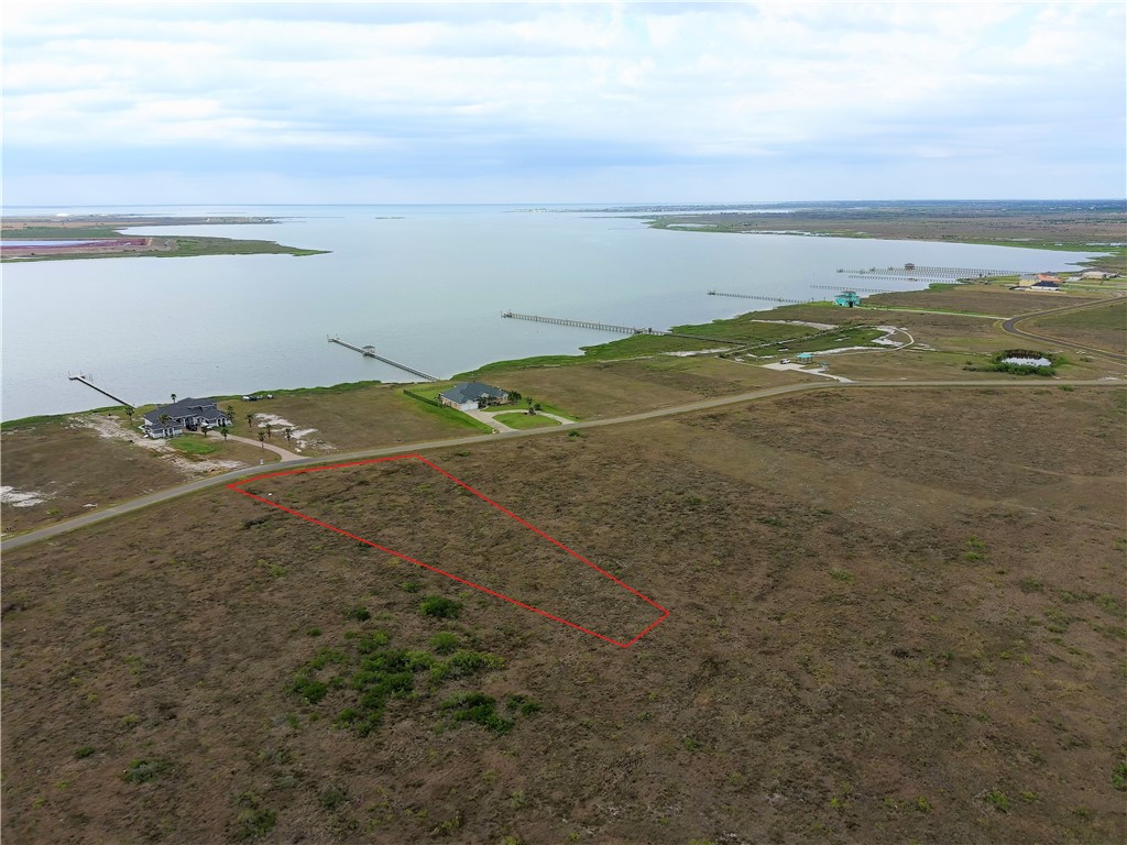 Looking for a perfect place to build your dream home?  Now is your chance to own this beautiful, one-acre, waterview lot located in the Sunset Bay Subdivision. This fabulous neighborhood has a fishing pier and a community pavilion for your enjoyment. You will love the coastal lifestyle and the incredible wildlife all around you!  Come see this lot today and make your dreams a reality!  You won't find a more relaxing place with the coastal breezes and panoramic views!  Sunset Bay is within minutes of Rockport, Corpus Christi, and Port Aransas.  Some of the best fishing in Texas will be right at your fingertips!  Red lot lines on pictures are approximate.