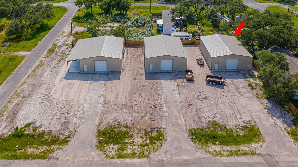 Introducing newly built, 2000 sq. ft warehouses in Rockport, Texas. This unit comes equipped with 12 ft roll-up doors, ensuring easy access for storing a variety of items such as boats, RVs, autos, and more. Pedestrian side entry doors and large driveway further enhance accessibility. Every warehouse includes a full restroom, complete with shower, for added convenience. These warehouses are more than just storage spaces - they offer opportunities for customization to meet individual needs. Transform them into your personalized workshop, business hub, or private storage unit - the choice is yours. Situated in the county with city water & sewer, these warehouses are a practical solution for those looking to avoid high storage fees by owning their storage unit. Don't miss out on this opportunity to invest in your own warehouse space!