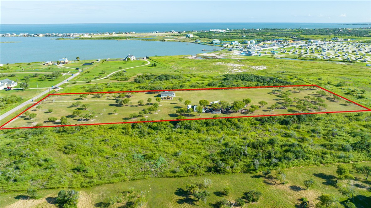 5 pristine acres in Copano Cove. Just a short drive to Copano Bay and surrounding Bays. A home already on site but needing work, this location would make a great R/V park. Cleared, level and ready for building or creating an income stream.
