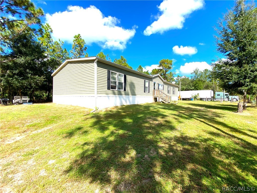 Peace and tranquility, enjoy the Florida Lifestyle on 5 acres of land (already split into 2 alt keys with the ability to build on the second lot once approved by zoning & county). Entertain to your hearts content in this charming 4/3 doublewide mobile home comes complete with three large sized living areas that can be used as: Living Room, Family Room and a Media/Entertainment Room. You will entice your family and friends with the wonderful gourmet scents from the welcoming kitchen with a huge island (7'x5'), stylish pendant lighting, lots of cabinet space (also in island), and a large walk-in pantry. The master suite includes a walk-in closet and a large master bathroom with dual sinks, separate shower and over-sized soaking tub where you can relax after a long day. The floor plan includes 3 more bedrooms and 2 more bathrooms, with TONS of closet and storage space, inside laundry, with room from an extra freezer. Roof 2018, HVAC 2018. Lovely new vinyl-wood planking installed in 2020 in the formal living room.  
Many in and out of Florida have found this hidden gem called Citrus County and found a  huge variety of flora and fauna for those craving the outdoors. Plus, infinite outdoor recreational options such as; boating, fishing, scalloping, kayaking, cycling, camping, and much more.