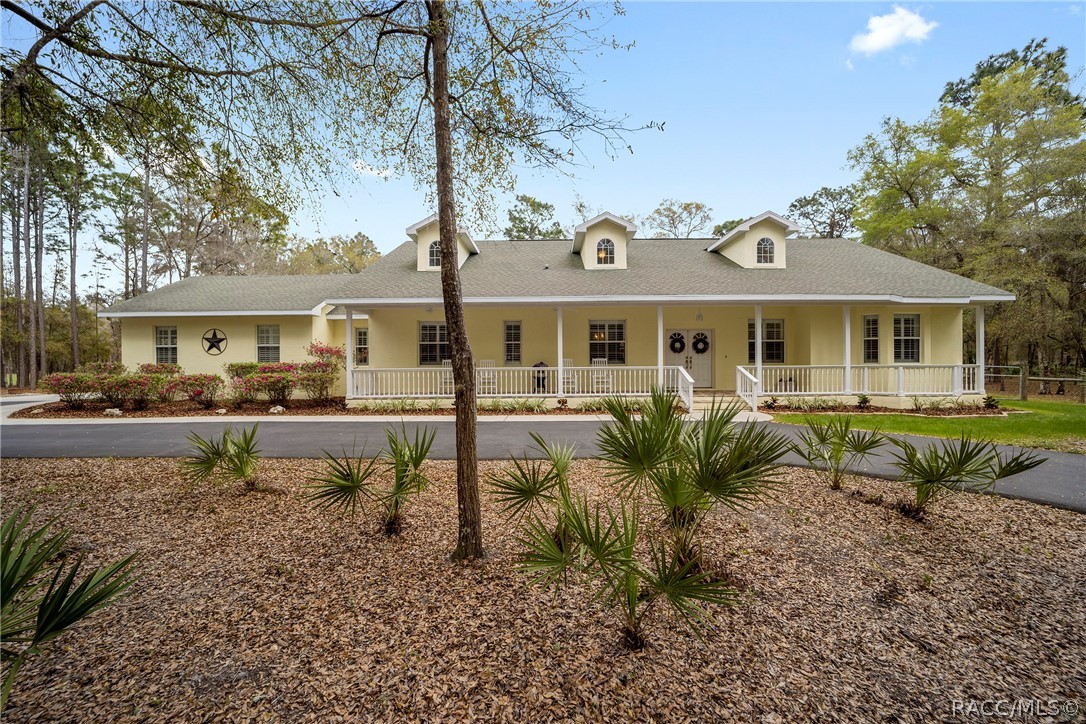 Beautiful custom built home on 5 acres in Crystal River is ready for it's new owners!  This impeccably maintained home that is just under 3000 square feet of living space, offers 3 bedrooms, 3 baths with split floor plan.  Formal living and dining area and a separate sitting room that could be used as an office, craft or playroom. Abundance of natural light shining through, plantation shutters, tile flooring and large lanai for entertaining.  Plenty of room for pool, chickens or your favorite furry friends will be contained in the fully fenced backyard. Located in a neighborhood with homes only all on 5 acre parcels.   County living with a short drive to downtown Crystal River. New roof! Not in a flood zone!
