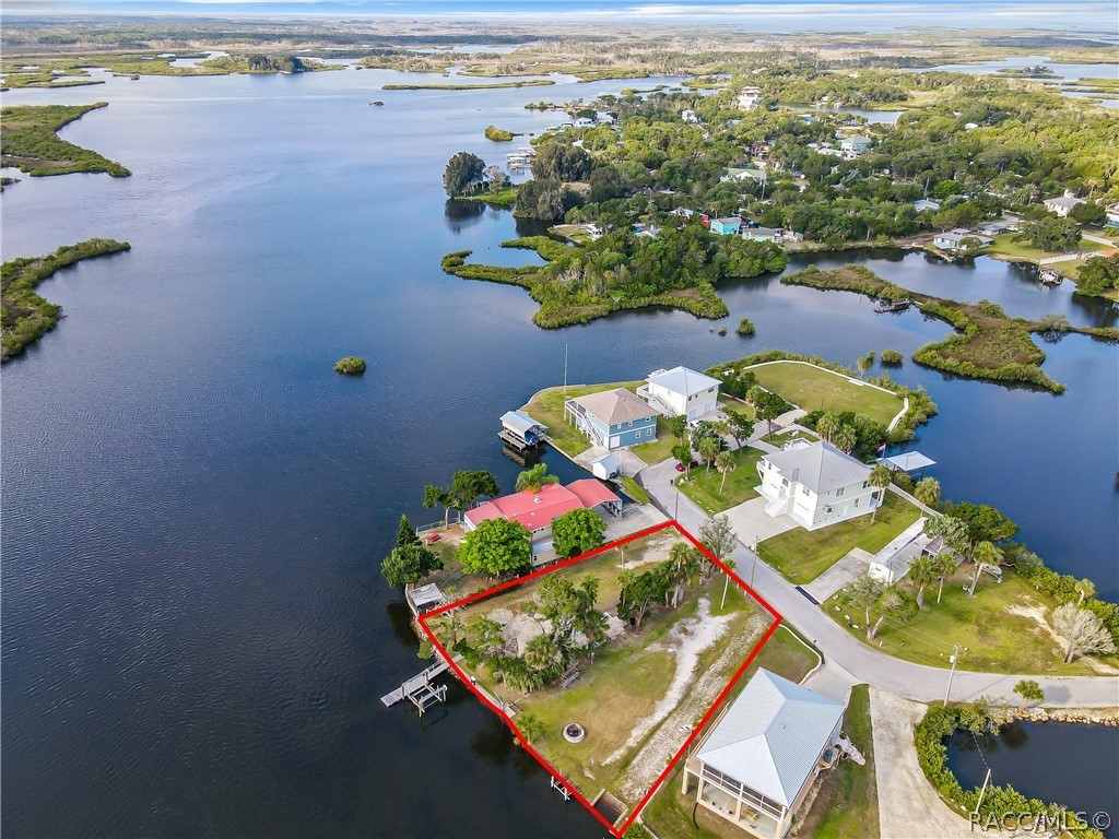 Two spectacular riverfront lots! Second lot alt key 1009553. Not only are these lots beautiful and cleared but they have power, water, sewer, and 2 RV hook ups! You will be already to go! This is riverfront, not canal! No bridges to maneuver to get to the Gulf! Not done yet.... there is a floating dock, fixed dock, boat ramp, boat lift, Jon boat lift and these lots are fenced/gated! I cannot put into words this rare opportunity. In this case pictures speak louder than words! Enjoy boating, fishing, scalloping, kayaking, restaurant hopping and swimming with the manatees!