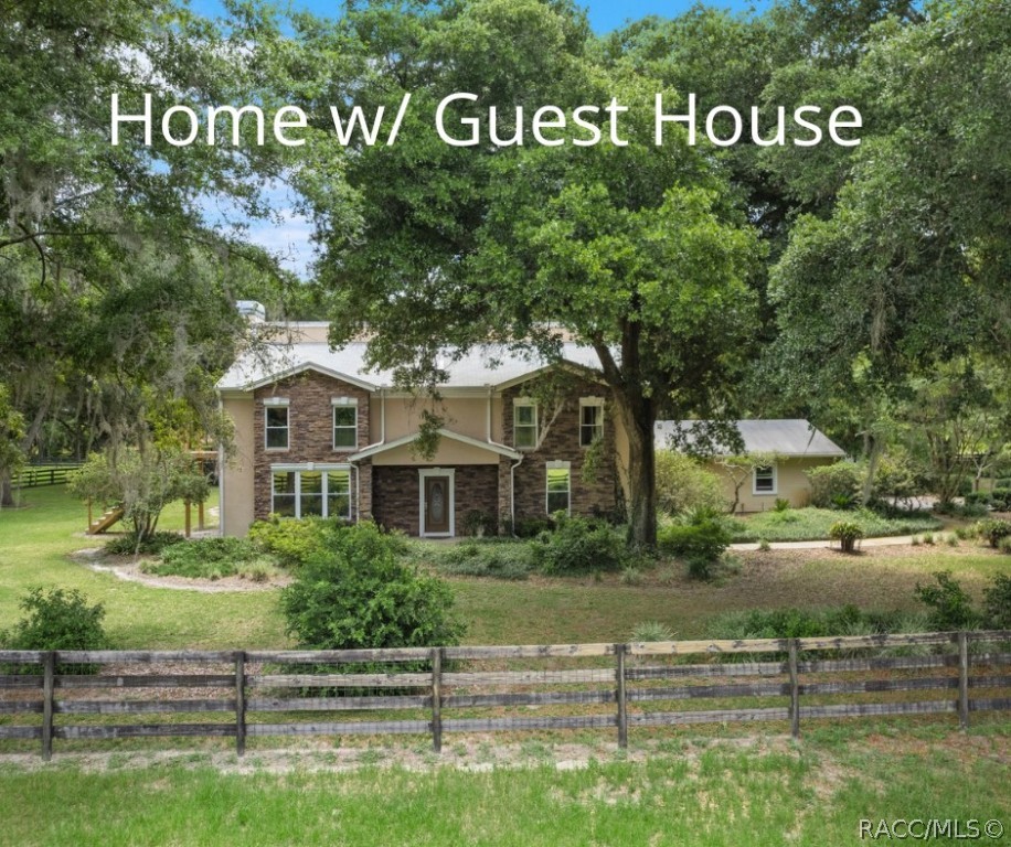 25 Acre Estate offering 2 homes a 3/2.5 & a 2/2, green pastures, 7 paddocks, fishing pond and beautiful oak trees! The main house has been fully renovated with wood laminate flooring, gas fireplace, open concept, cathedral cedar ceilings, roof 2017 and AC 2019. The gourmet kitchen is the heart of this home featuring custom cabinetry, high end appliances, butler’s pantry, center island with breakfast bar and a large walk in pantry. Master suite is on the second floor with a walk in shower, soaking tub and finished in a beautiful marble. The second suite is on the main floor. The loft works well as an office or den and could easily be converted to an additional bedroom. The 47' x 50' screened lanai is perfect for entertaining with a summer kitchen, heated pool and separate Jacuzzi. The main house has a generator, large two car garage with plenty of storage cabinets, and a 22' x 42' building to be used as you please. Guest house recently renovated with roof 2017, two bedrooms, two baths, living room, great room with wood fireplace and a glass enclosed back room overlooking the peace and tranquility of nature all around. There are so many possibilities with this home's use as an office, guest house, income producing or multi-generational. The property is unique with two separate parcels giving you more flexibility. The entire property is fenced, cross fenced and has security gate with an automatic opening. Great location south of town and 15 min. to I-75, 1 hour to Tampa airport.