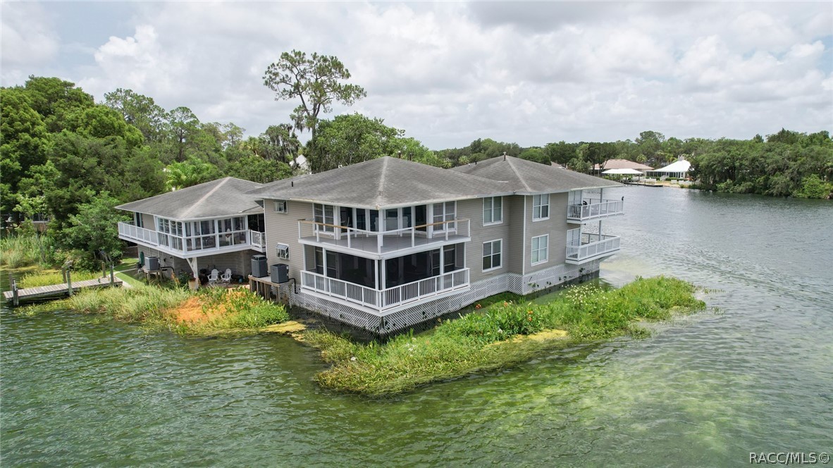 Rare opportunity to own waterfront in the Springs of Kings Bay. A beautiful 2 bedroom, 2 bath condo looking directly over the bay in one of the only gated communities in downtown Crystal River. This condo offers granite counters in both kitchen and bathrooms, the main bathroom has a spa shower tower and the spare bathroom has a walk in tub. Gas fireplace in living room for those chilly nights and a deck with retractable screens to sit out and watch those beautiful sunsets. This unit comes with an assigned dock and a parking spot in garage shared only by 2 other units.