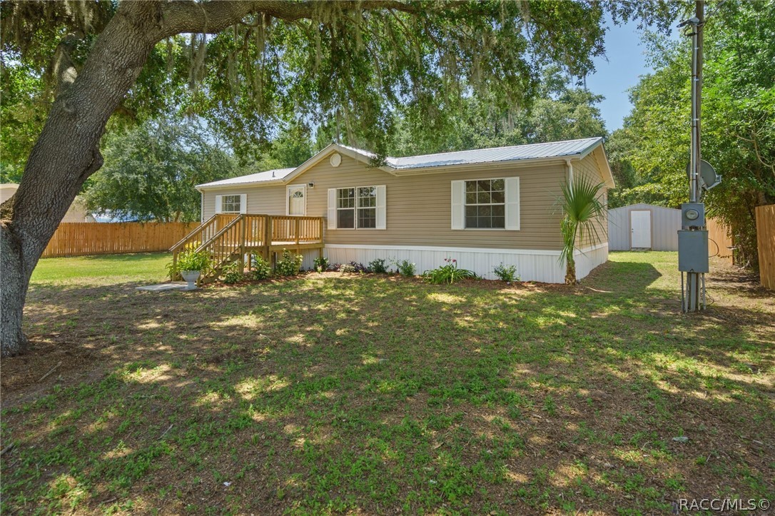 3 Bedroom, 2 bath doublewide with 20 x 40 metal garage with electricity and water and 10 x 20 utility shed on 1.2 acres.  New metal roof, RV hookup, new porches, new countertops in kitchen, freshly painted interior, new toilets.  No deed restrictions, no flood zone.  Nearby river and lake!  New central AC being installed!  New bladder and control switch on well.
Plenty of room for a pool.  Beautiful acreage with trees.  Fenced!