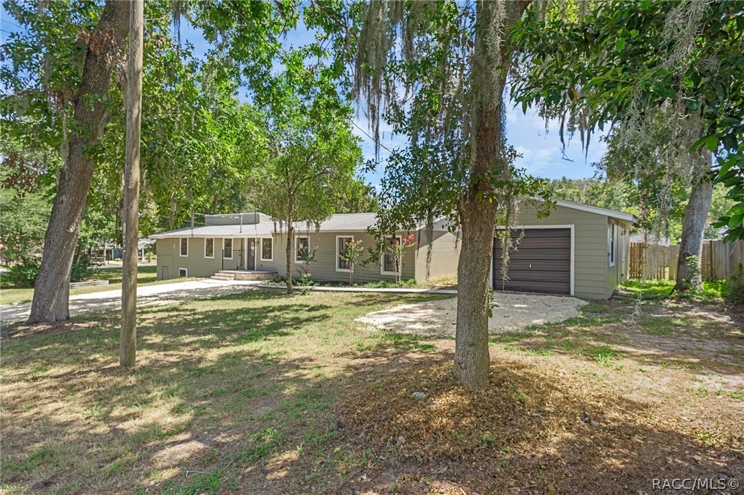 If it’s “home sweet home” you’re after, look no further! This 3/2 home has been completely renovated and is ready for new owners. Situated on a half acre corner lot, just across the way from Lake Tsala Apopka & Lake Henderson. New LVP flooring throughout, fresh interior/exterior paint, completely remodeled bathrooms & kitchen w/ new appliances, wood cabinets, & granite countertops. Plenty of space with an extra large master bedroom w/walk-in closet & en suite bathroom, foyer, dining room, 2 living rooms, office area, a full walk in laundry room that could easily be converted into a 4th bedroom & a screened in porch overlooking the backyard. Back deck is great for grilling. New pavered walkway & front steps. Detached garage/workshop outside PLUS additional storage under the house (FL basement!) There is so much space packed into this place! RV/Boat parking with NO HOA's! In addition to being in a peaceful neighborhood, this gem is just a few miles away from the charms of downtown Inverness & an easy drive to the FL Turnpike & I-75. This is not a home you should miss! Schedule your showing today!