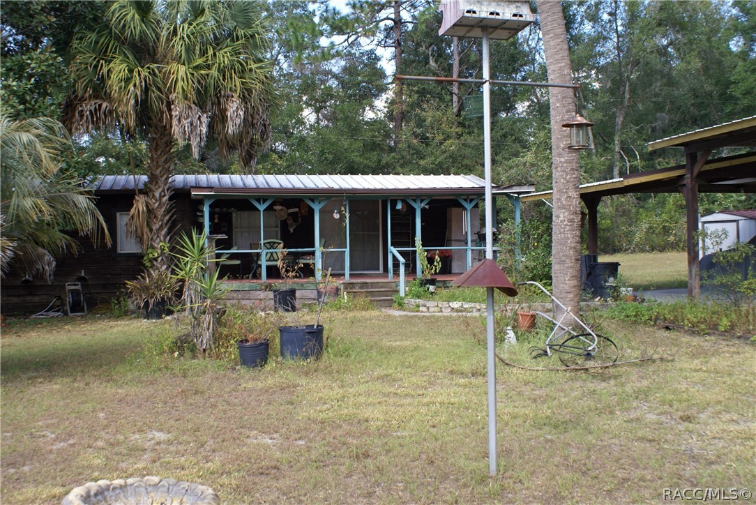 Fisherman's weekend retreat. Quiet county living with No HOA. Over an acre with 2 large carports to park the trucks, boat and trailer. Newer metal roof on both home and carports. Three Bedroom (1 Bedroom used as an office) and large eat in kitchen with propane gas cook top (Propane tank is owned). Inside laundry/Utility room. A short drive to Lake Rousseau, Withlachoochee River and Rainbow River. One large storage container and 2 sheds. Sits on a beautiful lot with mature Oaks and fruit trees.