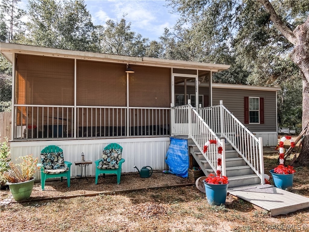 Like new, five year old doublewide (28 X 44) with 10 X 20 screened porch on front.    Septic system replaced.  Very quiet 
neighborhood.  Near the Withlacoochee River for fishing and water sports.  Conveniently located.  Near school, doctors  grocery.
Nice workshop/storage shed.  Owner is leaving stove, refrigerator, washer and dryer and couch in den.    Call for an appointment today!