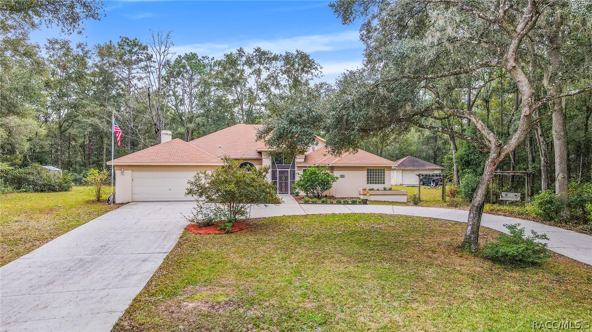 This truly is living the best of both worlds, located in a treed, winding road setting and yet minutes to shopping, entertainment and recreation.  Rainbow Springs in the heart of Dunnellon has much to offer, the feeling of peace, minutes to the springs and all sorts of water activities or dining out at one of the many eateries within a short drive.  This home features a wonderful split plan lay out where there is room for everything you would want.  Currently the 4th bedroom is being used as an office/den/school room, but it can easily be a bedroom for guests.  Windows , A/C and water are new.  At the back of the property there s a detached 2 car garage, do you need a workshop or a place for that collectible car, you got it. Sliders to the pool from the living room, main bedroom and kitchen give you a great view of the lanai and the backyard.  This is a great home and it should be your new home.  Don't delay, call today.