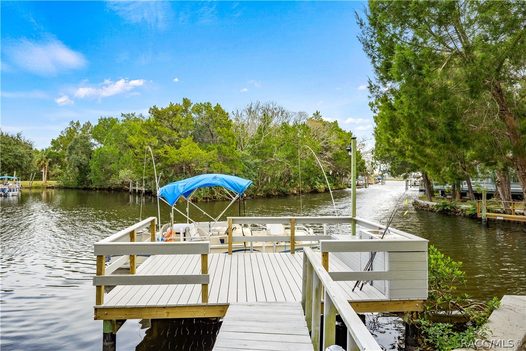 Do you long for the waterfront lifestyle?  Do you appreciate a custom built home with superior architecture and an ideal location?  If so, this home is for you!  Located near the Homosassa River in Riverhaven Village, you will find this home on a short canal about 600 ft from the main river saving you from constant boat wakes but still offering a most appealing view of the river.  Entertaining will be easy with the large vaulted ceiling great room that opens to the huge screened area with heated pool, separate bathroom, and hot tub.  Relax on the pool deck and view your large sizable
 deck & dock, & the river beyond. Also on the main floor is a spacious separate family/TV room, formal dining room, & casual eating area adjacent to the well planned  kitchen with coffee bar.  Close by is the spacious master suite.  Waking up each morning in this master bedroom to this view will start your day in the best possible way.  The upper level offers a roomy open sitting room, 2 bedrooms, & a upper deck screened room with yet another terrific view.  The garage is oversized. The roof is new November 2022.  The community offers friendly neighbors, optional community club, sizable open space park, storage lot for boats and RVs and more.  Call today for an appointment to view this idyllic waterfront property.