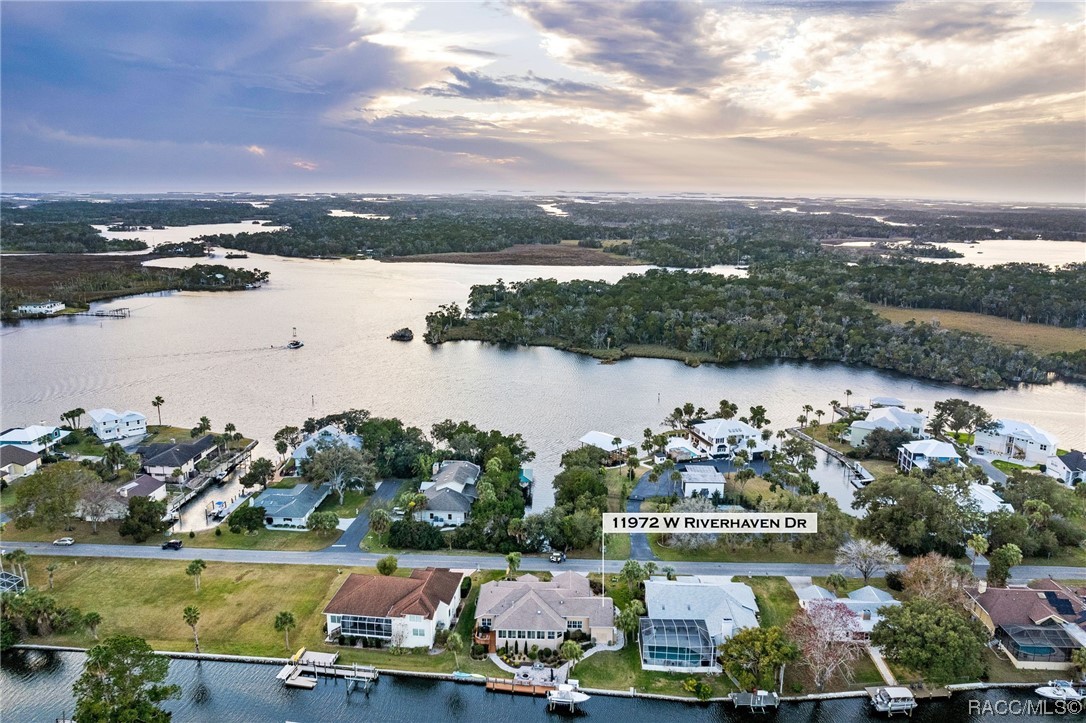 Can you recognize true quality in a waterfront residence?  Step into this meticulously built home and you will find five-star features throughout. The location is just 580 feet from the Homosassa River giving you easy access to the Gulf of Mexico with ideal river and gulf fishing at your command. Just a short distance to the Riverhaven Marina and waterfront restaurants. The neighborhood of Riverhaven Village is arguably the best planned waterfront community on the Nature Coast.  It offers a community park, clubhouse (membership optional), RV/boat parking area and friendly neighbors.  This home offers lots of extras - extra quality woodwork throughout, 3 zoned heating & cooling, 2 zoned surround sound system, 3 full baths with linen closets, 3 bedrooms with walk-in closets, stained glass windows, built-in whole house generator, new dock & upper deck with maintenance-free decking, 9000 pound boat lift with remote control, and more.  Ask your Realtor for a complete list. You will love living here.  Call today for an appointment to view this terrific home.