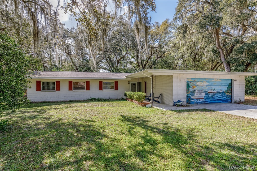 Check out this super adorable 3/2/1 house on .96 Acres! 4 LOTS! Would make a great investment property with room to add a couple of more houses !!
Only 10 minutes from the downtown Crystal River area offering shopping, eating, and entertainment in quaint cracker-style houses and buildings!  There's easy access to the many area waterways for fishing, kayaking, boating and swimming with the Manatees!  We can't forget to mention golfing at the Plantation or the many biking and hiking trails throughout the County!
AND only 5 minutes to the Suncoast Parkway entrance on HWY 44!! Get to Tampa or the Villages in less than an hour !!! 
(Cash only because it needs a new roof! Priced accordingly.)