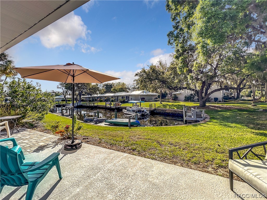 MOTIVATED SELLER! WATERFRONT END UNIT CONDO WITH A DOCK! ONE OF THE NICEST COMMUNITIES AROUND SURROUNDED BY WATER AND PROTECTED STATE LANDS. MANATEES SWIM RIGHT OFF THE DOCK! THIS NICELY KEPT, 2 BEDROOM, 2 BATH CONDO HAD A NEW METAL ROOF INSTALLED AND NEW WINDOWS AND DOORS IN 2020. IT COMES FULLY FURNISHED WITH NEARLY ALL ITEMS TO CONVEY SO YOU CAN MOVE RIGHT IN! NO BRIDGES TO THE GULF OF MEXICO FOR SOME OF THE BEST FISHING AND SCALLOPING AROUND. NEAR THE LOCAL BEACH AND GREAT RESTAURANTS. FEEL MILES AWAY, YET NEARBY EVERYTHING CRYSTAL RIVER HAS TO OFFER. MONTHLY MAINTENANCE FEE COVERS FLOOD AND HAZARD INSURANCE, CABLE/WIFI, TRASH, LAWN CARE, ROOFS, IRRIGATION, COMMUNITY POOL, STREET LIGHTING, ON SITE PROPERTY MANAGER, BONDS/ACCOUNTING, BUILDING MAINTENANCE, ROAD MAINTENANCE, AND EXTERIOR PEST CONTROL. THIS UNIT IS READY TO GO!