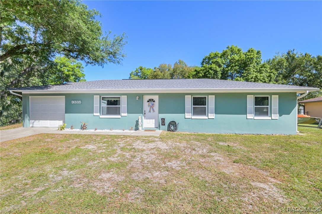 Less than two miles from downtown Crystal River! This home has an updated kitchen with plenty of wood cabinets and counter space, center island and pantry closet, and tiled floors in main living areas and bathrooms. The primary bedroom has bamboo wood flooring, and the bath is updated with glass enclosed tile shower. Bath 2 was also updated and has tile and tub. Curl up in the family room and enjoy the wood burning fireplace! The living spaces are all open and flow well for entertaining. The roof was replaced in May 2020. Windows were replaced along the way, too! Public water was connected in 2019. There is a tankless hot water heater and a backyard shed.