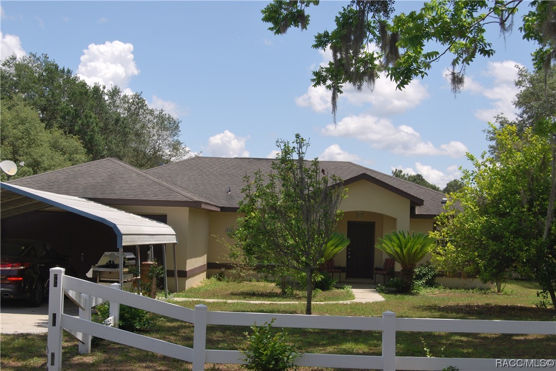 This Spacious 9.65-acre property and spectacular pool home located less than 10 minutes from Downtown Inverness and 20 minutes from Ocala has too many possibilities to mention them all. The almost rectangular lot has approximately three quarters of pastureland supplemented with approximately one quarter wooded where berries abound. The pasture is perfect for your horses to roam freely or for the cows to graze. The 3-bedroom, 2-bathroom split floor plan with a spacious living area is perfect for the family. Combine that with a large inground caged swimming pool and a very large lanai. There is even a fenced area attached to the pool cage for the dogs as well as a run. Surrounding the home are 3 separate carports and storage areas as well as an oversize shed for your toys, projects or equipment. Need to store your RV then the 50 amp outlet will be a big help. Bring your animals and toys, this property is secluded yet convenient!