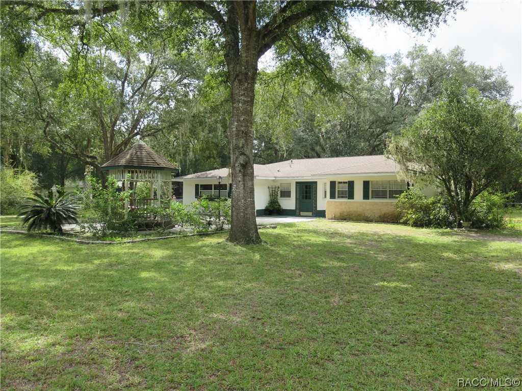 Want to get away from it all? Located on 1 acre with no deed restrictions, this 3 bed / 2 bath home is the ideal solution. The family chef will love the spacious kitchen complete with pantry. Master suite with walk in closet, private bath & walk in shower. Need a workshop or space for your toys? This home has plenty of options. Country feel, yet minutes from town. Convenient access to boating, restaurants & shops. Private setting, relax to the gentle sounds of nature. No flood insurance required.