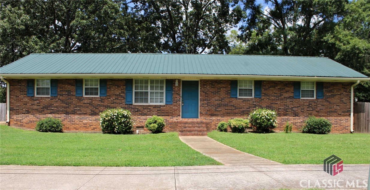 Charming location on a corner lot in downtown Statham. All brick ranch with recently remodeled bathroom that has a gorgeous soaking tub and tile walk in shower. There is a large shed in the back for storage. The backyard also has a tall privacy fence so you can enjoy quiet evenings relaxing or take a walk around the block with ease as sidewalks run throughout the area. In fact Statham Library and Elementary school are within walking distance. With minor updates of fresh paint and flooring you will have instant equity in your home. Don't miss your opportunity to own a home at an affordable price!