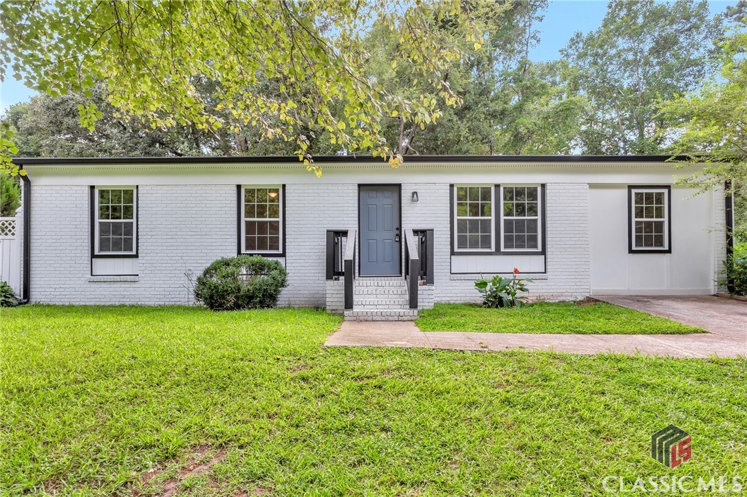 This RENOVATED BRICK RANCH is within minutes of UGA, Downtown Athens, shops, dining, the FIREFLY TRAIL, and many more of the great attractions found in Athens. Inside you will observe NEW WHITE KITCHEN CABINETS and LVP FLOORS, GRANITE COUNTERTOPS, a BATHTUB and STAND-IN SHOWER, all within freshly painted SHIPLAP WALLS. The DECK overlooks a private and SIZEABLE BACKYARD. Explore the virtual tour for measurements, then stop by, have a look, and picture yourself right at home.
