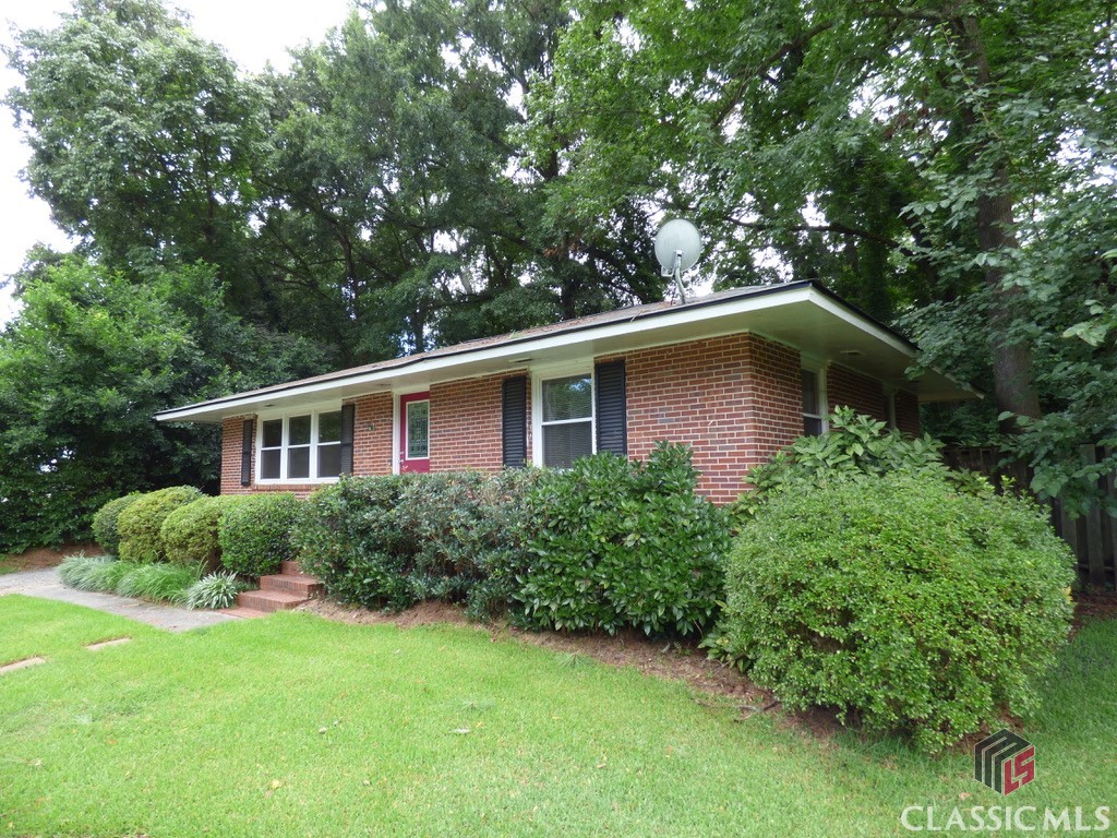 What a refreshing price for this well maintained/updated brick cottage in the thick of all Normaltown has to offer, yet set on a quiet cul-de-sac with plenty of on and off street parking. Just 1246’ from here to the UGA Health Science/Med School Campus and just a little farther to the neighborhood commercial center with Bars, Restos, Groceries, Hardware Store, Brewery, Cafe, and more. Piedmont hospital a walk away. All of the Prince Ave corridor offerings right there and downtown beyond beckons. Bus from Health Science campus is free and will take you straight to downtown/campus. Home is a 3/1.5 with LR/DR combo and a kitchen with cabinets and counters everywhere, especially for a house this size (all appliances stay, including fridge). Hardwoods throughout main floor, hallway, and bedrooms with tile in the baths and highest end vinyl in the kitchen. Back door access to super private back yard waiting for your personal touch, and when you keep reading to learn about all that has been done to the home, you will realize quickly that you can truly devote your attention to making an outdoor oasis for evening parties or a little fire after bopping around the Normaltown night life. Here goes and I know I’m leaving stuff out. Done by current sellers at various times since 2012: new dp windows throughout; all new plumbing and exterior main sewer to the street (with a clean out); all new electrical (including panel and exterior overhead main line); HVAC; All insulation in attic removed and 2’ of new insulation blown in; New roof in 2021; New Exterior Doors; New Hardware; Ceiling Fan/Light combos; Totally renovated kitchen with new floors, cabinets, counters, appliances, sink, backsplash, plumbing fixtures and more; W/D stay and the laundry closet has shelving and a pocket door that has been added for easier access; Updated hall bath; sellers added half bath in front bedroom (could have a shower added. Ask me how); Harwood floors recently redone; New security flood lights; and more. Semi-annual pest control. At this price in this market, jump now. We have a lender who can close you in 8 days! No joke. Let us show you.