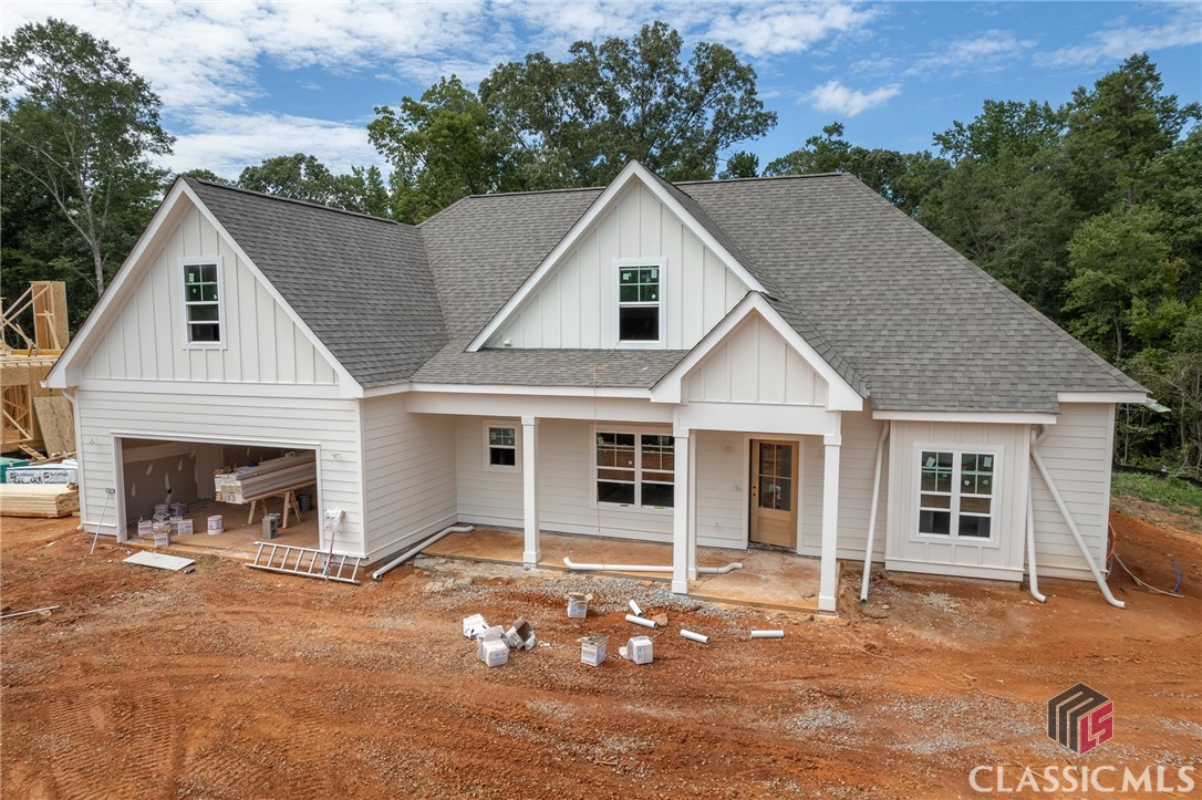 Step out into this quiet community and into the door of this brand new 4 bedroom, 3 bath home.  Located in North High Shoals, a quaint small town on the Apalachee river in the highly desired North Oconee School District where the motto is “Small Town, Big Heart.”  Built by Award Winning JW York Homes, you’ll find a formal dining room on your left upon entering with an open concept great room, kitchen and breakfast area in the heart of the home.  Walk around the designer, chef inspired kitchen and run your hand across the stone countertops and bespoke finishes. A few steps from the kitchen you’ll find the generous master suite, bath with twin sinks, separate shower, free standing soaking tub and expansive walk-in-closet. On the main level you’ll also find a large guest suite bath and stairs leading to the second floor with two bedrooms, one bath and a finished bonus room. This spectacular home sits within biking distance of the growing North High Shoals Park and minutes from downtown Athens, Watkinsville and the rebirth of the historic city Monroe. Welcome to North High Shoals!