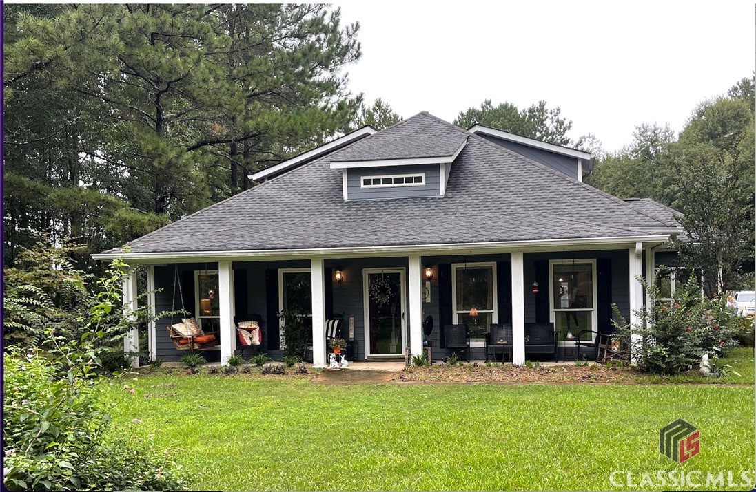 Don't miss this gorgeous 3BR/3.5 BA Craftsman home situated on 3.59 acres in Oconee County. This well maintained property features a beautiful open concept floor plan that allows communal spaces to flow freely into each other. Enter the sunroom to enjoy the natural light and luscious outdoor landscape or step outside to the spacious backyard paradise. Relax by the fire pit, entertain guests, or enjoy the weather. This property has extra space to sweeten the deal! It includes a bonus room with a nice sitting area, full bath, and two closets. Moreover, the recently constructed garage/barn includes an unfinished area that can be transformed into an additional personalized space. Approximately 20 minutes to Athens, Madison /I-20, and 316. It will not last long! Call to schedule a showing. Listing agent is related to seller.
