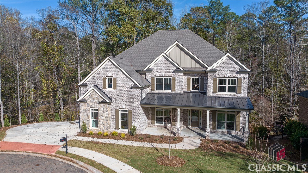 Incredible NEW construction in Oconee's highly sought after Rowan Oak subdivision with TWO MASTER SUITES!! This stunning 5 bedroom home is ready for a new owner!!  To the left of the foyer entry is the formal Dining Room. You will love the open concept main level layout from the Family Room, Kitchen and Keeping Room! The Kitchen is impressive with a large center work island, granite countertops, tile backsplash, under cabinet lighting, gas cooktop & large walk-in pantry. The entry from the garage is just beyond the kitchen and flows from a functional mud room into the laundry room. The main level is also where you will find the first Master Suite with walk-in closet and private bath with vessel tub, tile shower and double vanity. On the upper level of the home you'll find the second generously sized master suite. The master bath includes a stylish vessel tub, tile shower, double vanity and linen closet. The walk-in closet is ENORMOUS!! There are 3 additional bedrooms found on the second floor, 2 full baths and a Media Room. Full Unfinished Basement. Don't miss the covered back porch... The perfect spot to wind down after a long day!!