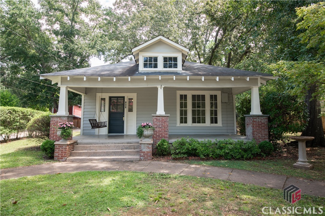 Welcome to Five Points! Don’t pass up this amazing package deal offering TWO COTTAGES on 0.53 acres in one of Athens’ most desirable neighborhoods. 163 Milledge Terrace, built circa 1933, has some serious curb appeal and is considered the primary home on the property. Only 1.3 miles from Sanford Stadium, this 1,216 square feet cottage would make the perfect place to cheer on the Georgia Bulldogs. Take a minute to swing on the front porch and get ready to be charmed by this little gem. Great natural light filters through the large windows making the space feel open and airy. Hardwood flooring runs throughout most of the home. The two bedrooms, one with a wood burning fireplace, share a full size hall bath. Kitchen, pantry and laundry room are situated together and walk out to a screened in back porch. 163.5 Milledge Terrace, built circa 1946, sits just behind the primary house and was originally used as a workshop. Over the years, the dwelling has been converted into 1,250 square feet of living space. The main level has been outfitted with a kitchen, bathroom and two common areas. Two bedrooms and a shared bathroom with clawfoot tub can be found on the second floor. Bonus… each cottage has its own electric meter adding value should you decide to expand on the large 0.53 acre lot. Want to know more? Schedule a showing to see 163 / 163.5 Milledge Terrace in person. A  true opportunity to #LiveWhoYouAre in Five Points!