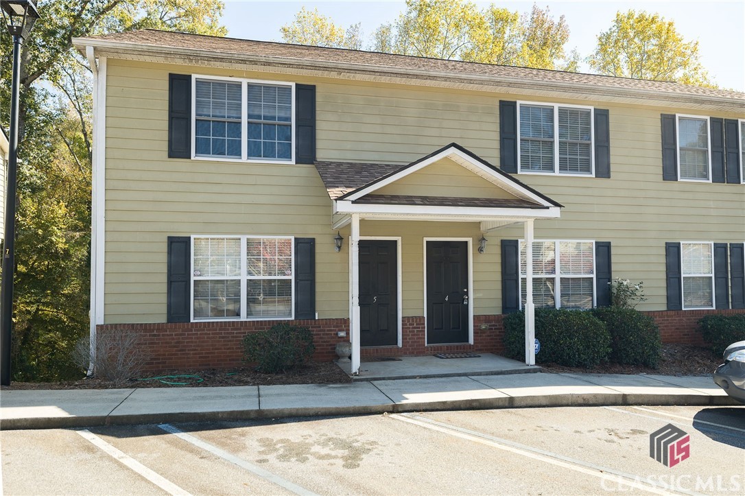 Move in ready! This well maintained townhome has 3 bedrooms and 3.5 bathrooms. Perfectly located to the Athens bypass, Normaltown and less than 10 minutes to campus. New flooring and paint on the main level. Roof was replaced in 2019. Open floor plan on the main along with a half bath and laundry closet off of the kitchen and spacious family room. There are 2 bedrooms and 2 baths upstairs. Each bedroom has its private bathroom with tub/shower combination. As you enter the basement there is a large flex space and also a private bedroom with its own bathroom. The basement has its own private entry as well. Great investment property. It was previously rented at $1500 per month.