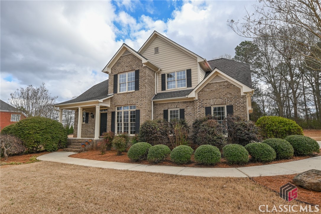 This elegant brick home is located in the exquisite Camden Park Subdivision, just off of Simonton Bridge Road in Watkinsville, GA.  With 4 bedrooms and 2.5 baths it is the perfect sweet spot between price and beauty. Site built hardwood floors have been impeccably maintained by the owner over the years and cover the entire main floor with exception of the Owner's Suite bedroom which is a lovely, soft, cream colored carpet. Just off the foyer is a formal dining room with gorgeous chair rail molding that also opens into the kitchen.  The open concept living area contains the kitchen, eating area, and living room. The kitchen boasts stainless appliances, gorgeous dark wood cabinetry, granite countertops with a raised bar for quick meals on the go while catching up with the household chef! Just beyond the kitchen is a hallway that leads to the garage on the right and leads to the Owner's Suite on the left.  The laundry room is tucked conveniently in between the Owner's Suite and the garage door. In addition to being on the main floor, the Owner's Suite bedroom has gorgeous tall tray ceilings, loads of windows that look out to the backyard, and a French door to quietly escape to the back patio. It also contains a luxurious bathroom with timeless travertine flooring, a walk-in closet, double vanities, and an extra large glass frameless shower with 3 shower heads for a spa like experience each and every day! The Living Room is the central hub of the home.  It has a grand fireplace, with large built-in opening for a TV or large picture.  This expansive room opens to the 2nd floor of the home and showcases the elegant staircase leading to the bedrooms above.  Upstairs are the 3 additional bedrooms and shared full bath with double vanities.  Two of the bedrooms have "secret" hide-aways or reading nooks built in and are pre-wired for tv / electronics (please use ladder at your own risk- pics are included for those afraid of heights)!  This lovely home is zoned for the award-winning Oconee County School District yet only 5 miles to UGA's Vet school and the shopping and dining options in Athens!  It's super convenient, only one mile, to all that downtown Watkinsville offers:  Chops and Hops, Girasoles, Mama Ning's Thai, Jittery Joes Coffee House, antique stores, the Court House, Oconee County Visitors Center and Watkinsville's newest shopping and entertain area Wire Park (also soon to house the Watkinsville Library). Do not delay, call me, Ann Davis directly at 706-207-1499 or at Coldwell Banker Upchurch Realty at 706-543-4000 today to schedule a private showing of this fabulous home before it is gone!