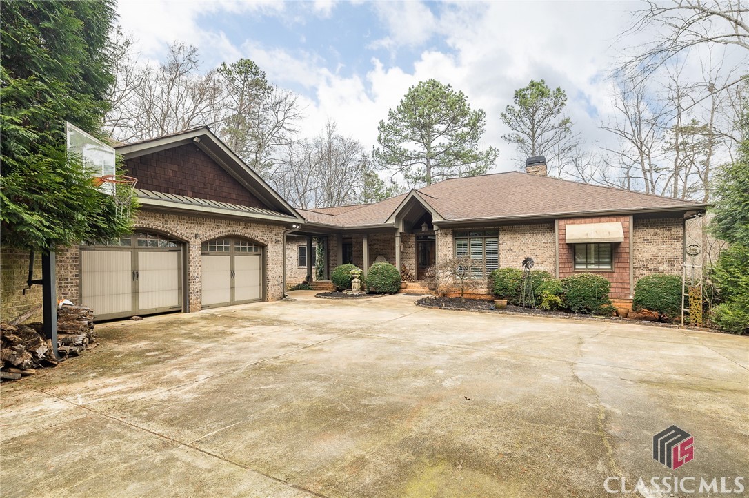 This luxury home sits on 13.58 acres in NORTH OCONEE! It is an absolute DREAM for the outdoor enthusiast or people who love to entertain. You will be greeted by a serene Koi Pond before a path leads you to a fenced-in Gunite Pool accompanied by a Poolside Cabana. Enjoy your morning while sitting on your spacious screened-in porch listening to the rushing shoals. "Little Shoals" Farm is another thing that makes this home truly unique. It has approximately 4-acres fenced with 3 cows, 9 sheep (5 are babies), 8 goats, about 24 chickens, guineas, and more!!

Inside, the main level hosts 3 bedrooms, 2.5 bathrooms, an entertainment room, a large living room, and a kitchen equipped to make a 5-star meal. On the terrace level, you will find 2 Bedrooms, 2 Bathrooms, a spacious family room, and a private office.