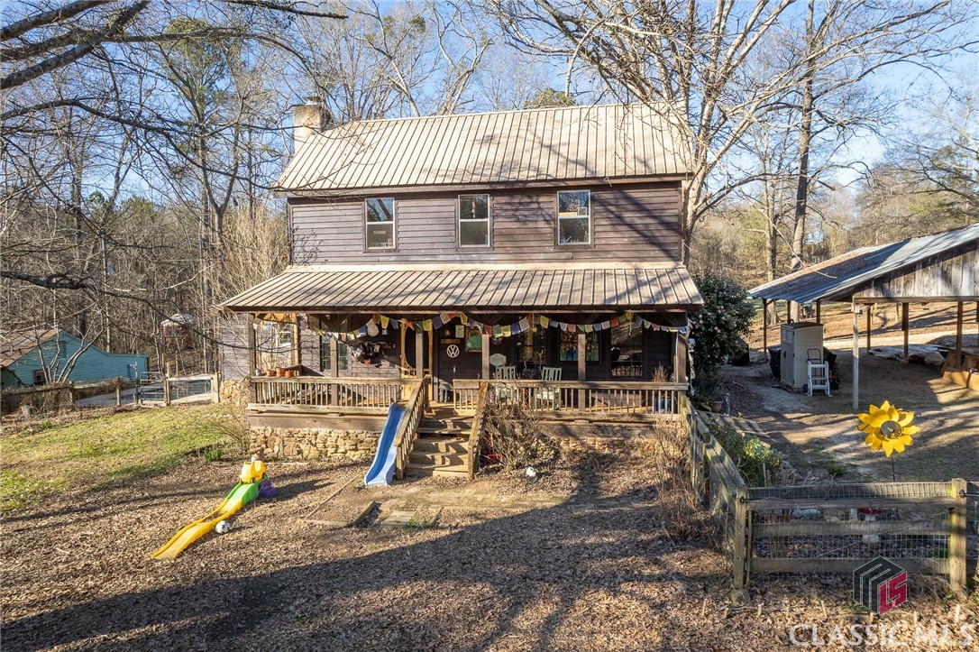 This beautiful 1900s historic home has a unique history and is situated on a beautiful 10 acre lot with a pond, outbuildings and a horse barn. The interior features a rustic wood stove, wide plank antique pine floors, ship lap walls and bead board ceiling, giving it a cozy, traditional feel. The open country kitchen is a great feature and the main level has a recently renovated full bathroom, adding a touch of modern. With two additional bedrooms, one with a private full bathroom, and an attic room that could be used as an office or bedroom, this home an abundance of space. Plus, the new HVAC upstairs will keep everyone comfortable year-round.     This stunning property is a must-see! The exterior of the home features a covered front and back porch, a brand new in-ground pool, two yurts, a greenhouse and storage with building supplies, there is something for everyone to enjoy. Plus, the guest house, partially restored, will make a great addition to the property. Don't miss this incredible opportunity!    It really is an idyllic property and perfect for anyone looking for a unique, historic home with plenty of outdoor space for horses or livestock.