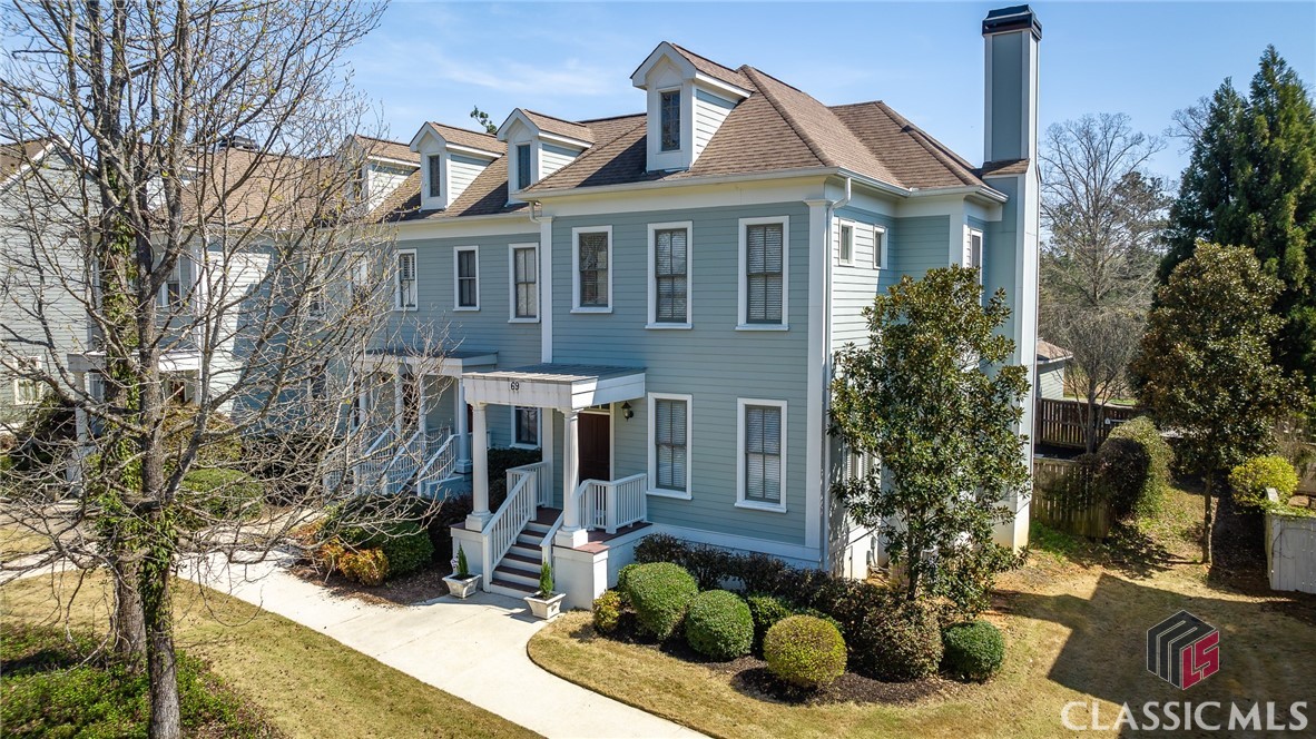 Experience the pinnacle of townhome living like never before with this extraordinary end unit!
If you love dog parks, butterfly gardens, little libraries, walking trails, and movie nights at the gazebo, then prepare to fall head over heels for this charming yet sophisticated Charleston-style townhome in the coveted Oak Grove neighborhood, where Southern allure meets modern convenience. 
Exceptional opportunity to experience townhome living at its best! This Charlestown style end unit is approached from the tree lined streets and sidewalks of Oak Grove that highlight this special neighborhood.  Entering the foyer, the  spacious open floor plan is captivating as it flows from the dining room into the great room with a wood burning gas fireplace anchored between oversized windows. The fabulous kitchen is discreetly placed adjacent to the great room and boasts granite counters and custom cabinets. Beautiful wood floors are found in the living areas along with 10' ceilings on the main level. Access to the laundry room, exterior back porch and owner's suite is through a hallway from the Great Room. The spacious owners' suite has a walk in closet, dual vanities, tub/shower and tile flooring. A half bath is also located on the main level. Two large secondary bedrooms with ensuite baths, large closets, a linen closet and 9' ceilings occupy the upper level. Also on the upper level is attic access which providing additional storage. With its high ceiling, this area has possibilities to expand into additional flex space. The interior has been recently painted. From the back entrance, outdoor living and entertainment options abound in the enclosed courtyard area with refreshed landscaping.  The rear entry two car garage is accessible thru the outdoor area.  Additional amenities offered in Oak Grove include tennis courts, a pool, private dog park, a renovated clubhouse and green spaces. Adjacent to this neighborhood is a newly developed shopping and dining area, including a newly opened Publix, adding to the experience of walkability and access. Your journey to exceptional living begins here. Embrace the Oak Grove lifestyle and make this extraordinary residence to your own today!