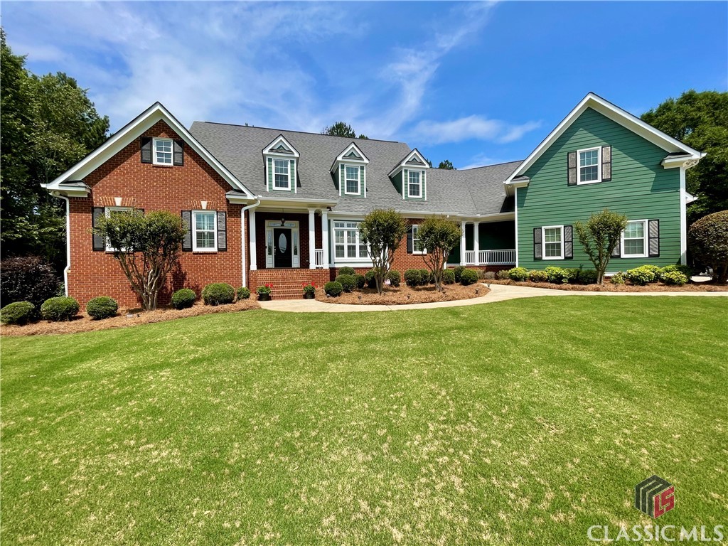Beautiful home in the sought after North Oconee school district! This custom home sits on just over 5 acres in the equestrian subdivision, Steeplechase, in Bishop, GA. With 5 bedrooms, 5 full baths, 1 half bath and plenty of living space & stylish touches throughout, you'll find this the perfect home for relaxing and entertaining. It's hard not to notice the lush front yard driving up to the home. The front walk leads you past a cozy side porch and on to the main front porch entry. The front entry is welcoming with tall ceilings, staircase to the upper level, access to the study with side bar area and formal dining room to your right. Just off the main hall is the owner's suite with tray ceilings, two walk-in closets and large master bath with on point tiled floors, dual vanities, tiled shower, jetted tub set in a bay window and water closet. The main living room has beautiful hardwood floors throughout, tray ceilings, gas fireplace and nice natural light streaming from the attached sunroom. The sunroom makes for a perfect spot to relax and look through the wall of windows to the back yard. On to an incredible space that includes a sitting area with gas fireplace, eat in dining and a kitchen open and ready for hanging out with family and friends. Plenty of custom cabinetry throughout, stainless appliances, dual sink, pantry, wall ovens and an island ideal for making great meals on the gas range. Off the kitchen is a hall that leads to a second set of stairs to the upper level, large laundry room, guest room with attached full bath and access to the 2 car garage with an additional garage bay. Upstairs you find a nice sized landing with a guest room with attached full bath to the right with another large guest room with attached full bath just down the hall. Continuing on you come to a hall that leads full bath and huge bonus living area perfect for relaxing with a book, watching movies or playing games. Just off that living space is another bedroom with good natural light. Outside you'll find some of the best parts of being in Steeplechase! just over 5 acres with a mix of lawn, landscaping and wooded area with a horse trail just beyond. Off the back of the home is one of the best features, a large patio with plenty of room for grilling and entertaining with a freestanding wood-burning fireplace. There is a storage shed through the wooded area just off the horse trail. In Steeplechase, homeowners are welcome to keep horses on their property and throughout the neighborhood are trails for taking horses on. The community association cost is $300/annually and goes towards maintaining the front entrance to the neighborhood while it's the homeowners responsibility to keep the trails clear on their own property. This is truly a great place to call home in such a quiet, unique setting just a short drive to the University of GA, local schools, parks and local businesses of Watkinsville, Athens and more!